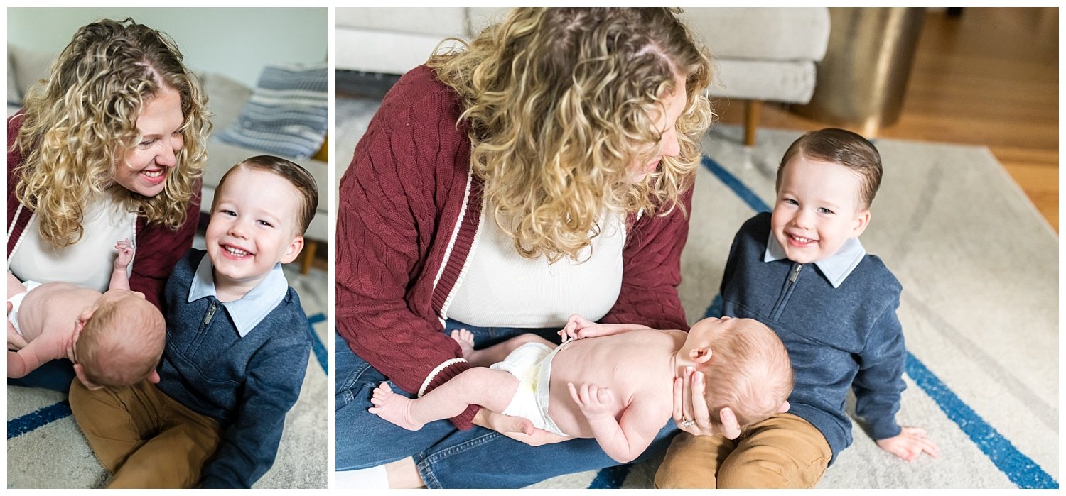 Mom, toddler boy, newborn baby boy smiling and engaging together at photo session in Bethesda Maryland with Tabitha Maegan
