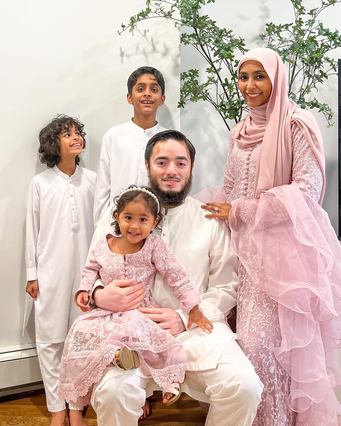 @thatmuslimmom and her adorable family matching blush pink cultural dresses and white thobes  