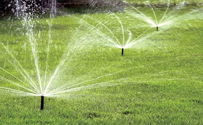 A worker presiding over irrigation services in Newberry, FL.