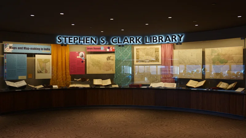 The glass case contained rare materials and a small selection of saris