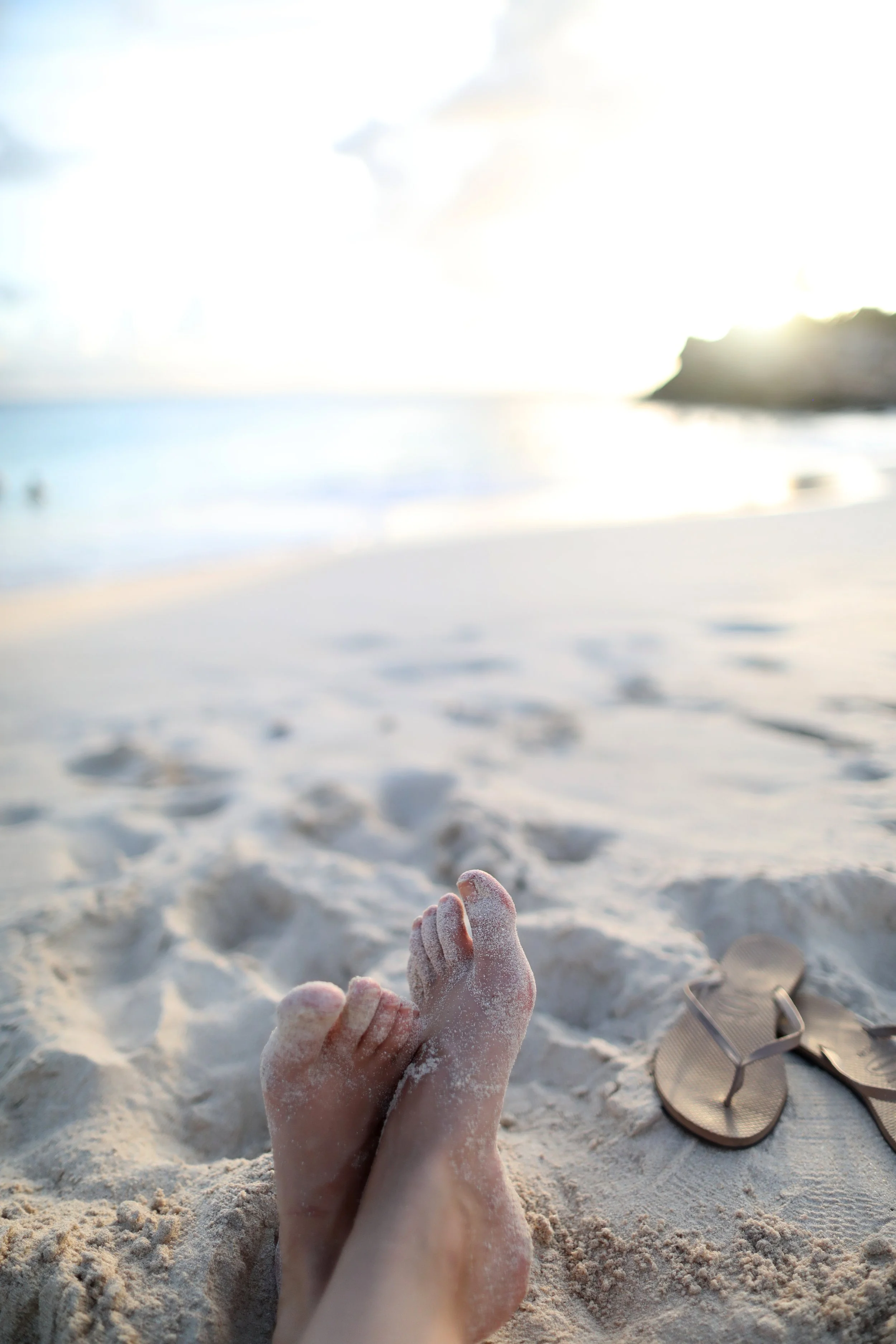 Feet in the sand at the beach in Sint Maarten