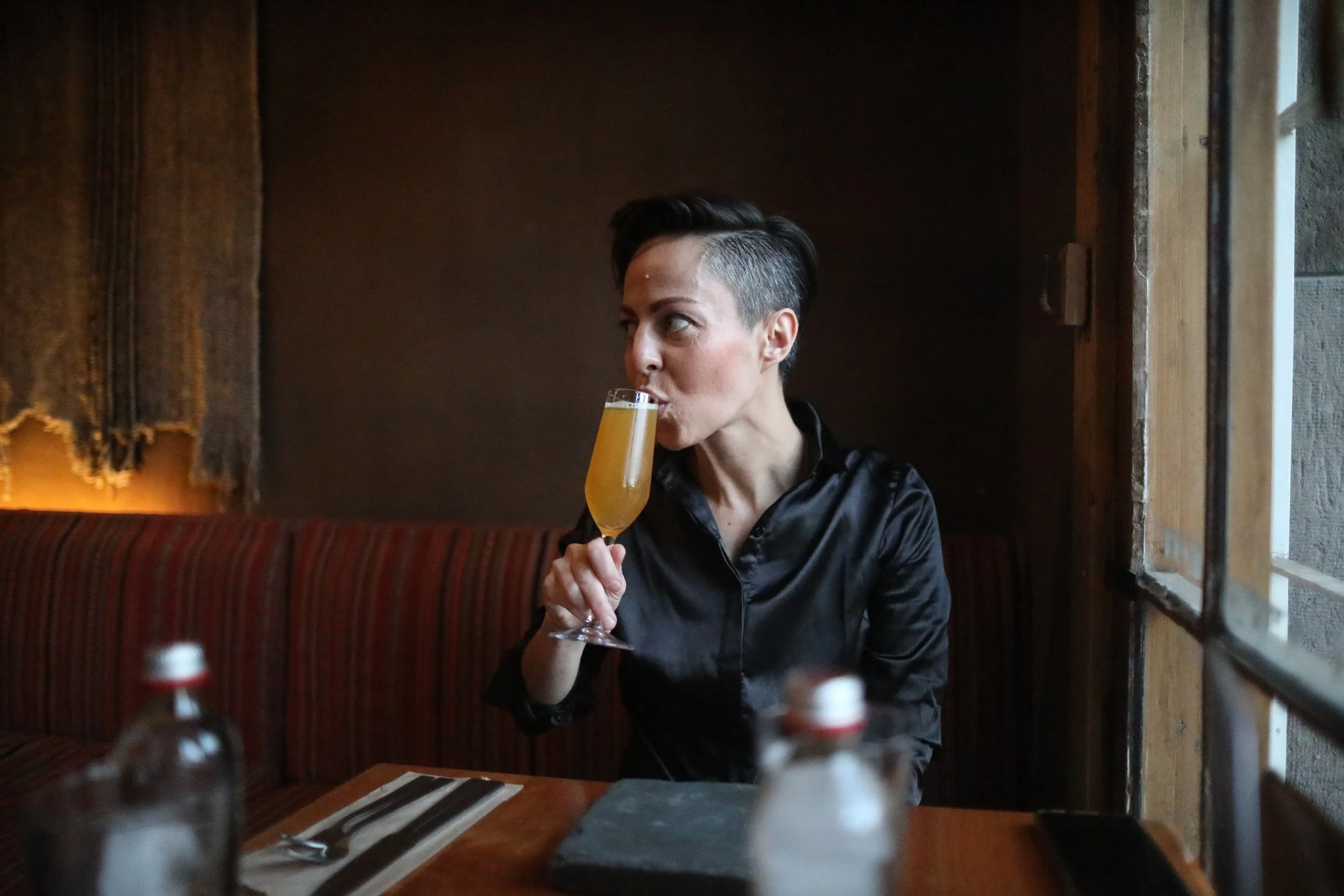 Drinking a cocktail in a restaurant in Santiago, Chile