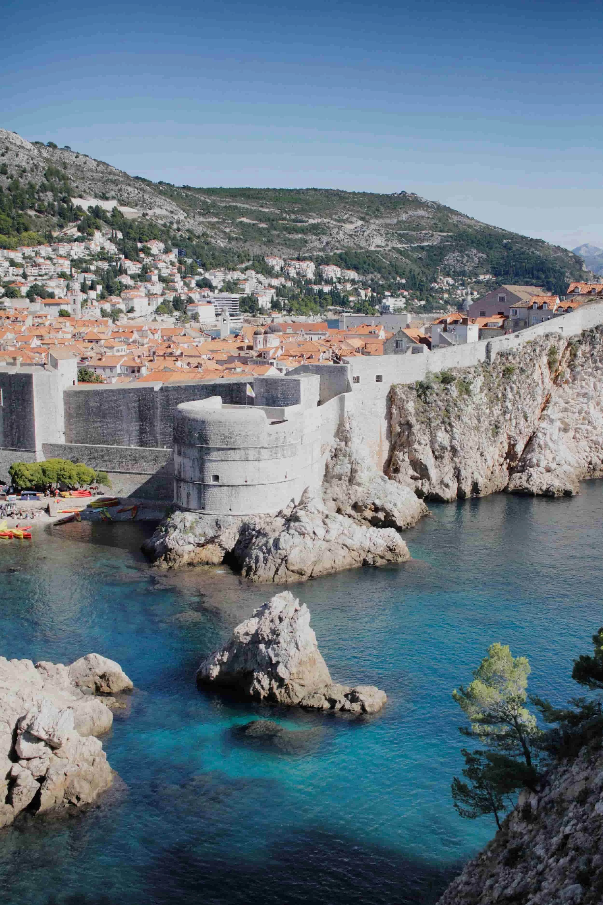 View of stone walls, ocean and mountainside in Dubrovnik, Croatia