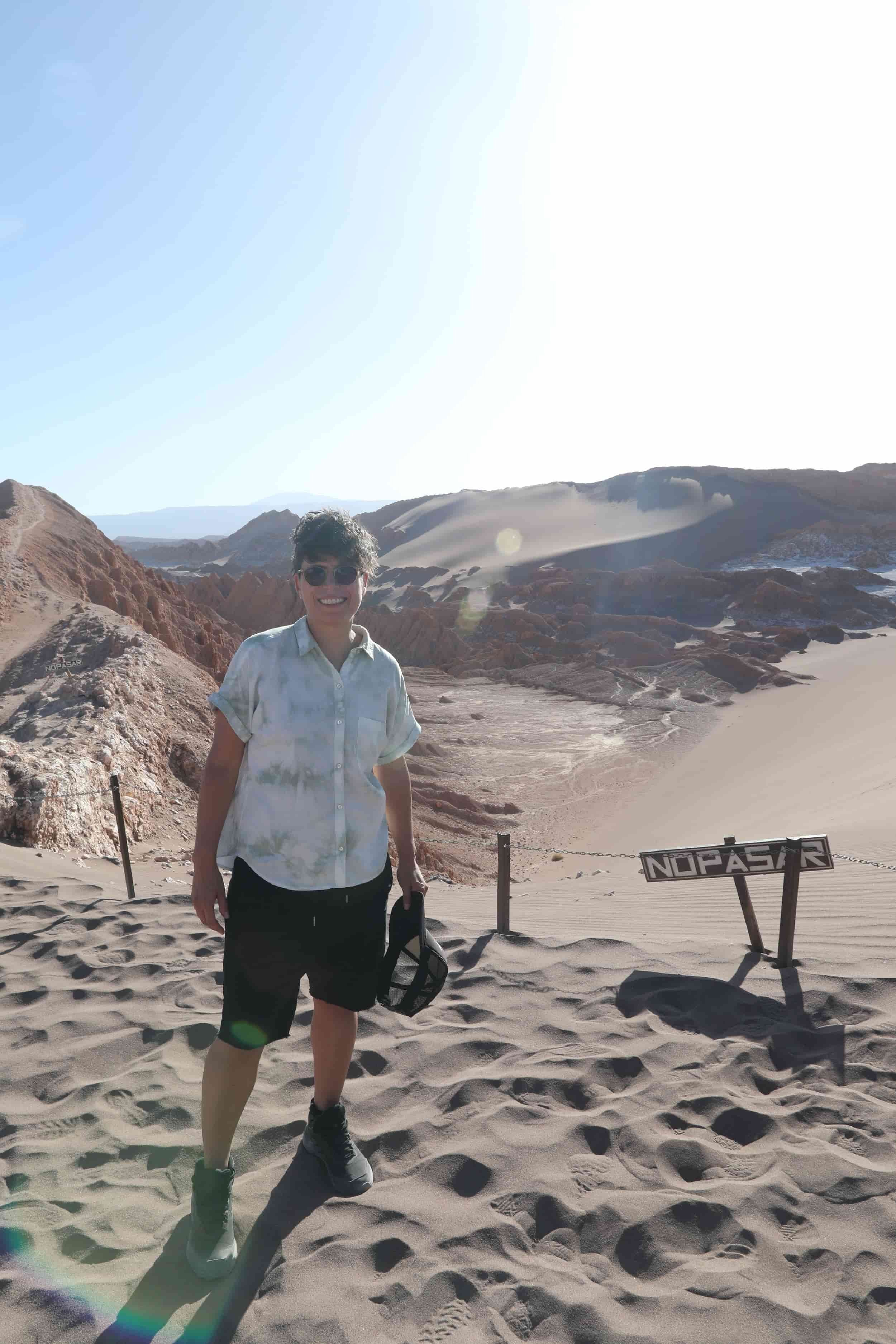 Valle de la Luna Chile, otherworldly landscape, girl at top of Great Dune