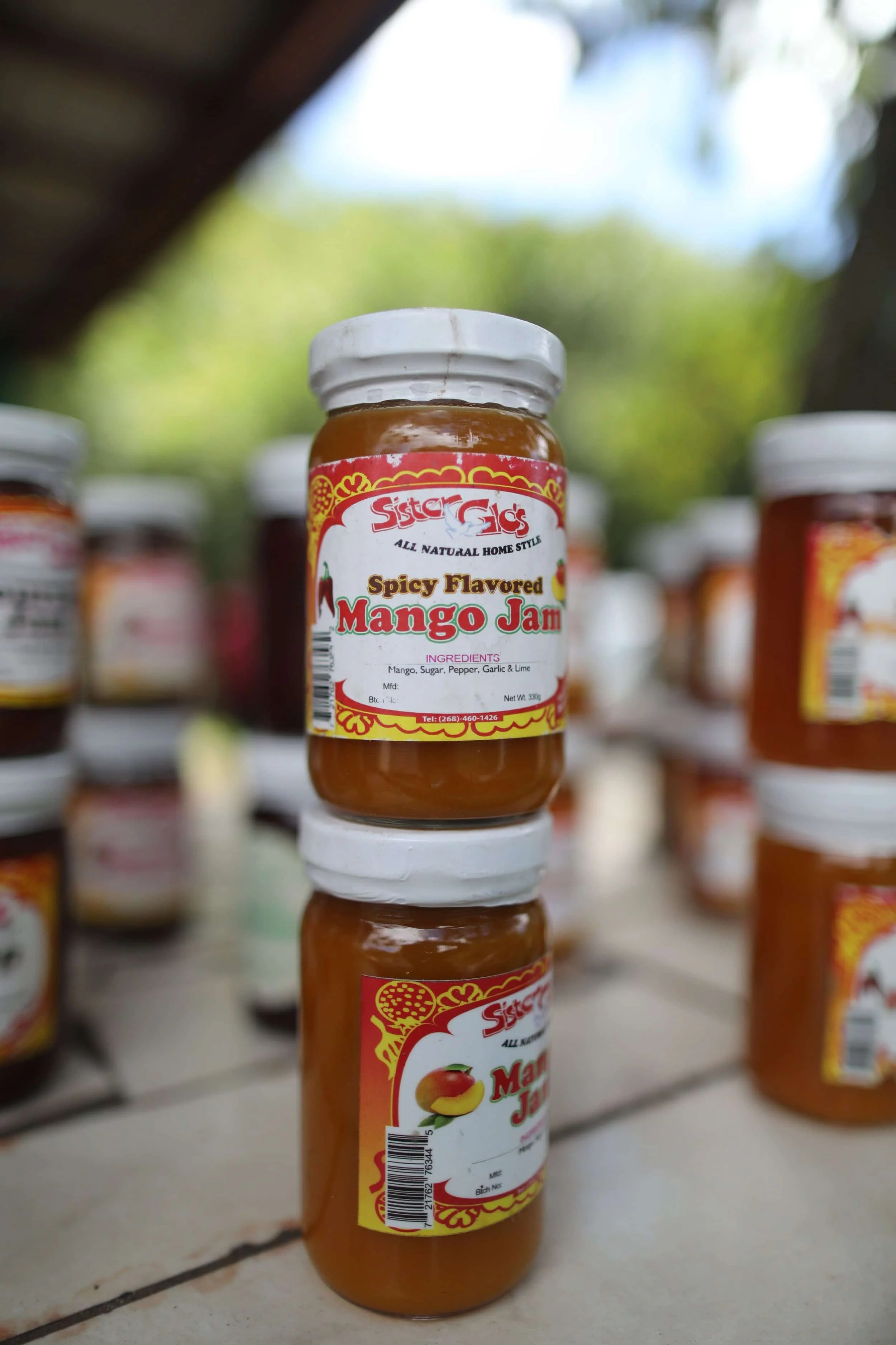 Jars of jam stacked at stall on Fig Tree Lane on Antigua island