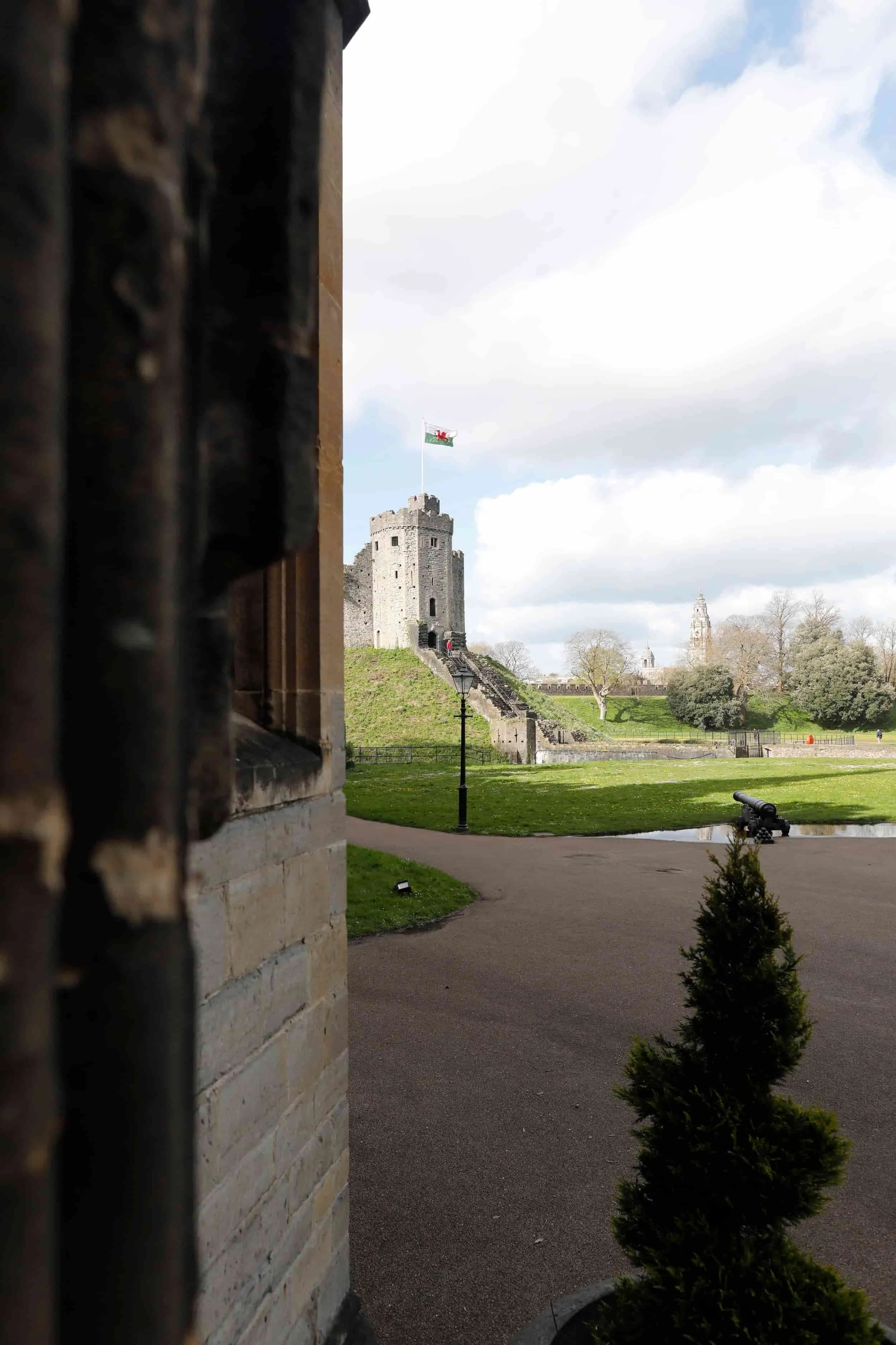 ThCardiff Castle with green lawn and blue sky, Cardiff UK