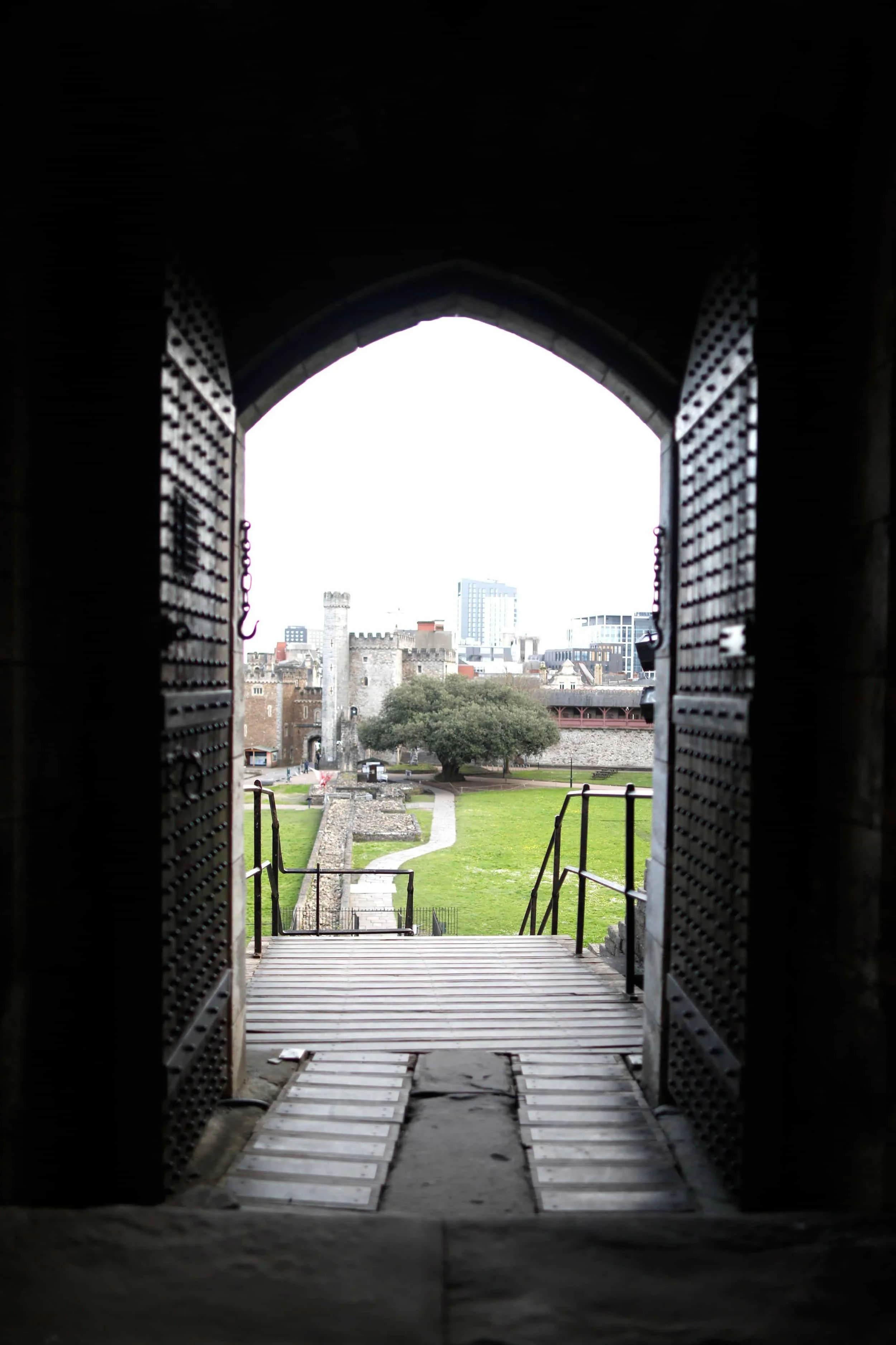 View from inside Cardiff Castle to the courtyard with green grass, Cardiff Wales