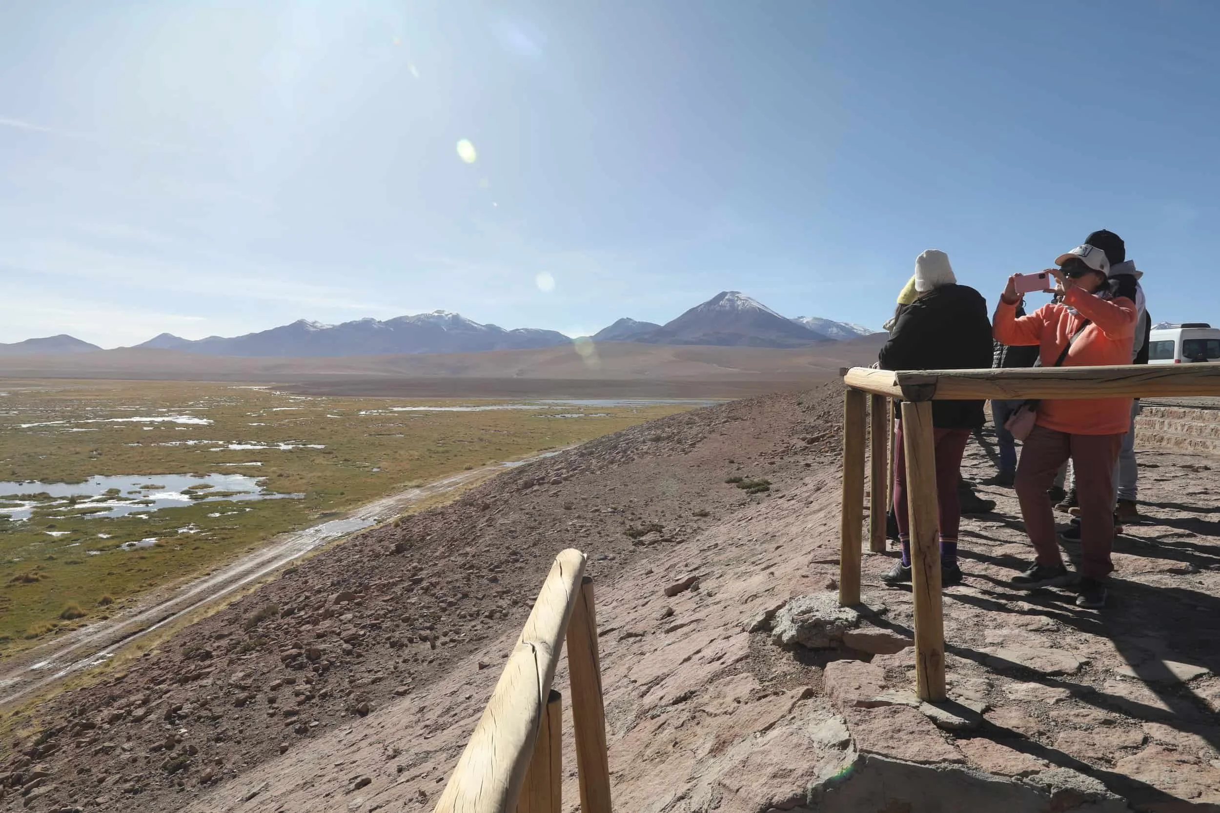 The Putana River winding through green Andean wetlands surrounded by volcanic mountains in northern Chile.