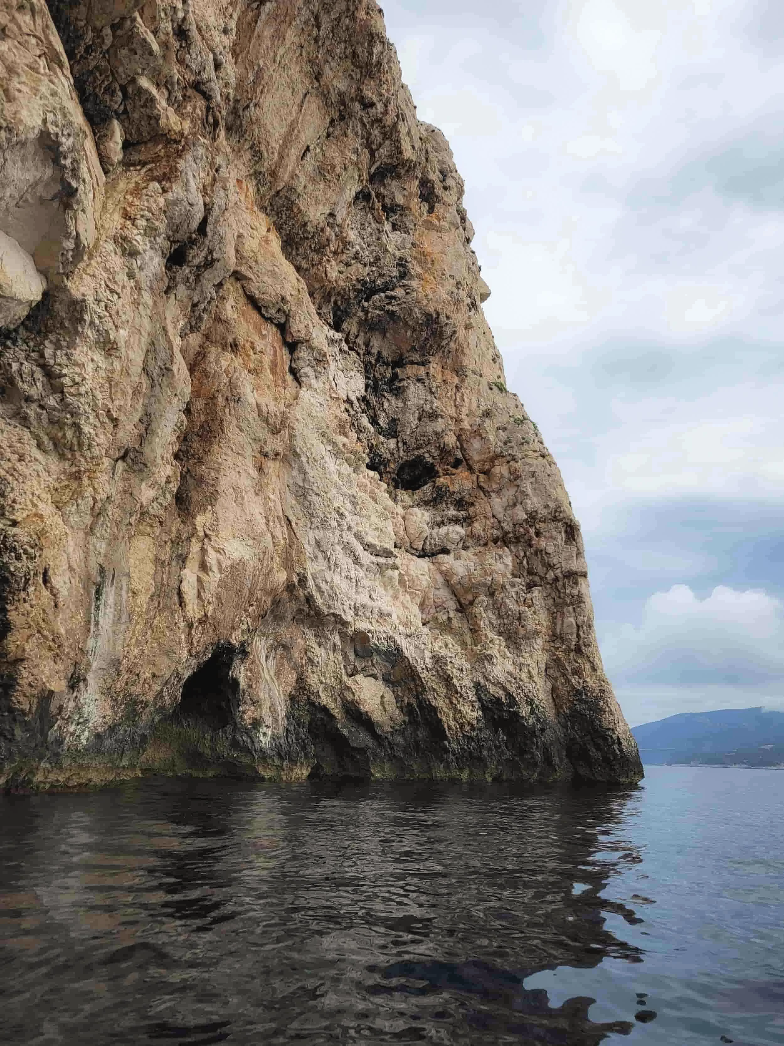Rocky cliffs and ocean near Blue Cave in Croatia