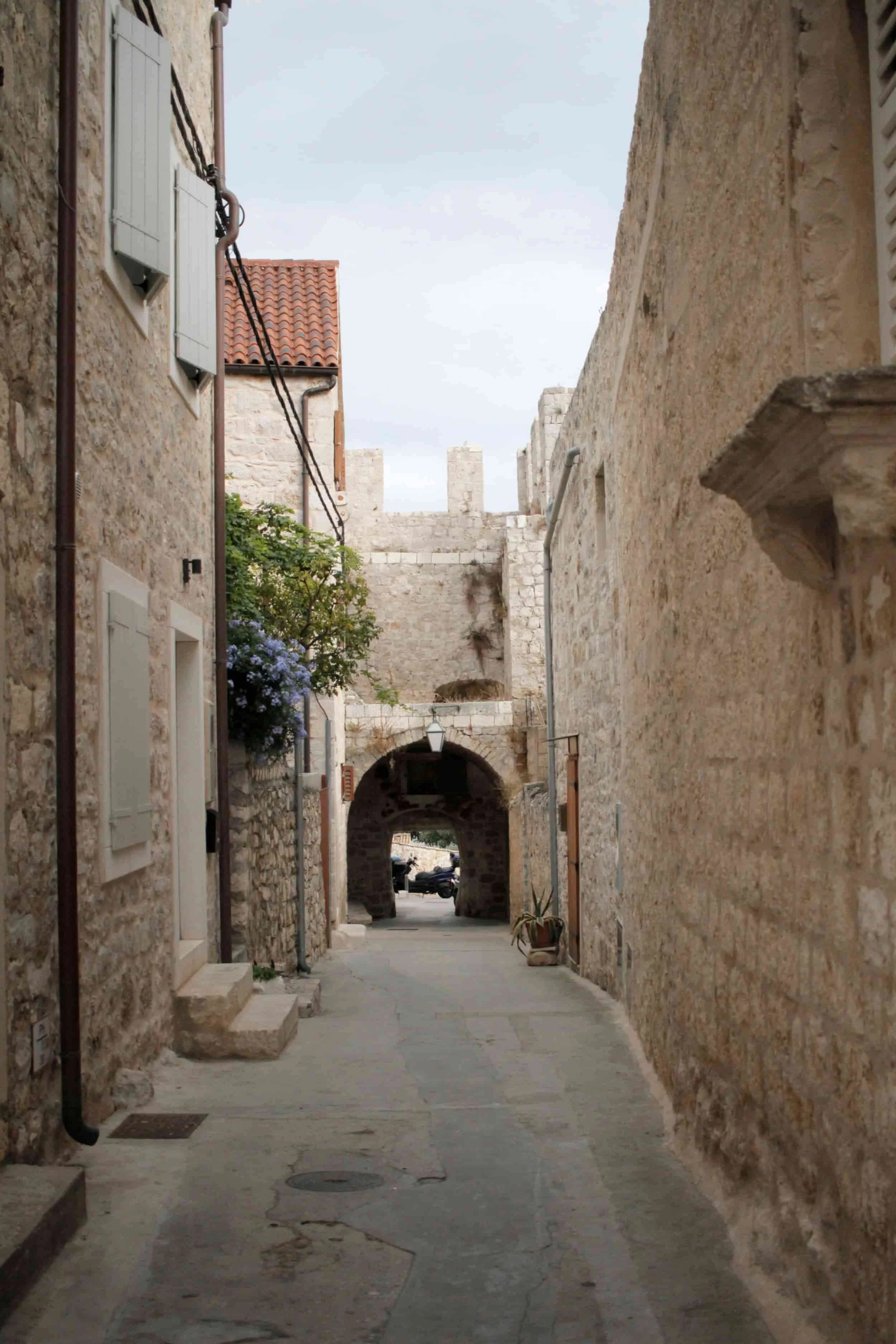 Alleyway with white stone path and buildings on Hvar Island on the Croatian coast