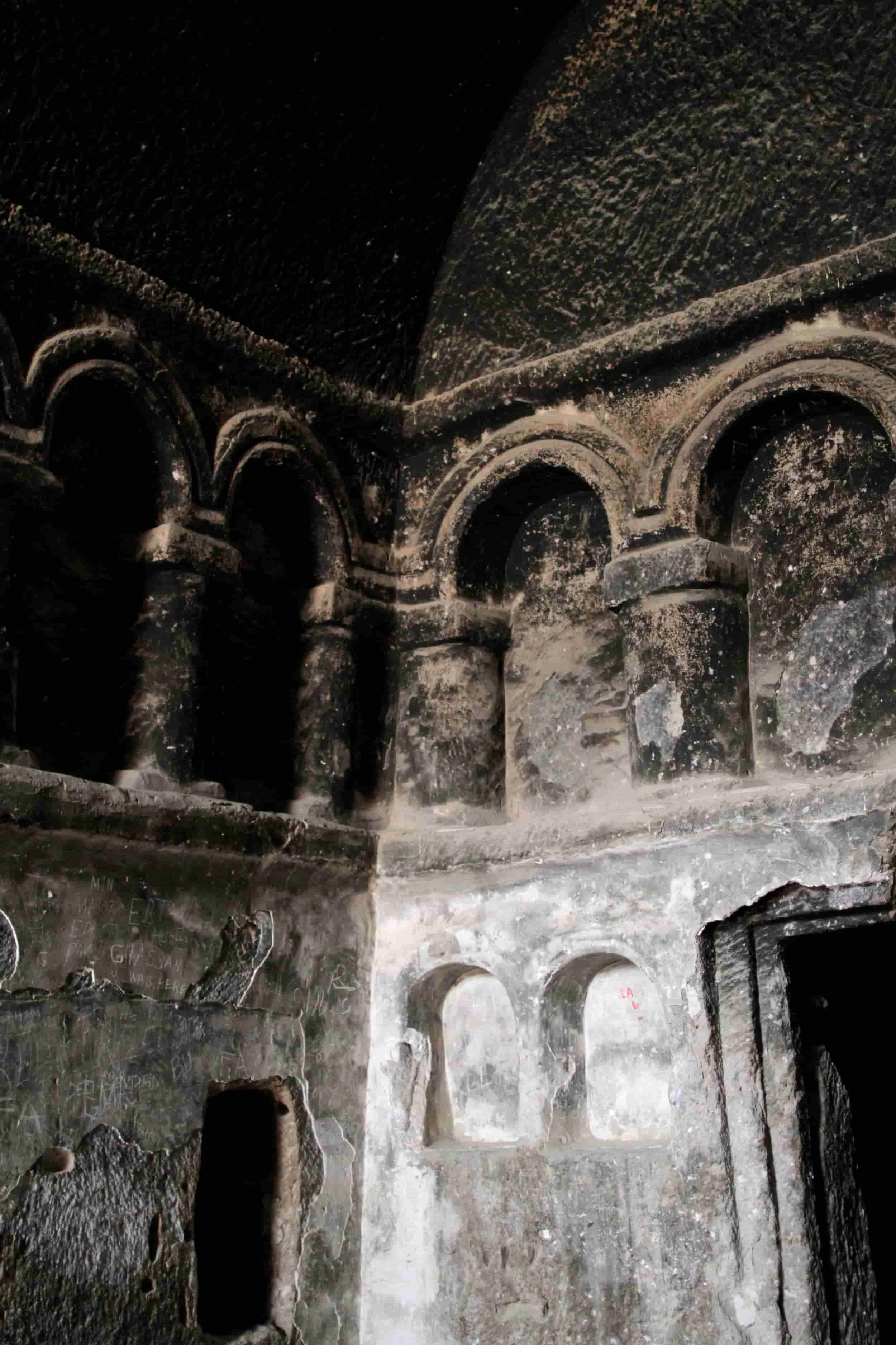 Inside a rocky outcrop with carved caves at Selime Monastery in Cappadocia, Turkey