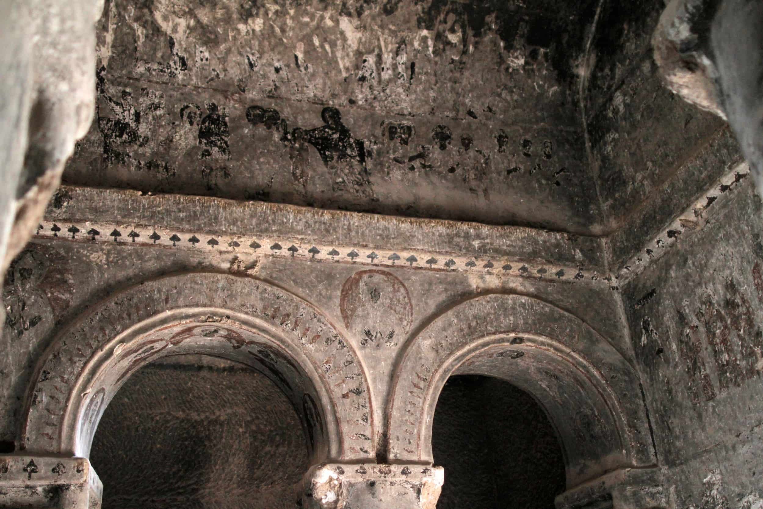 Inside a rocky outcrop with carved caves at Selime Monastery in Cappadocia, Turkey
