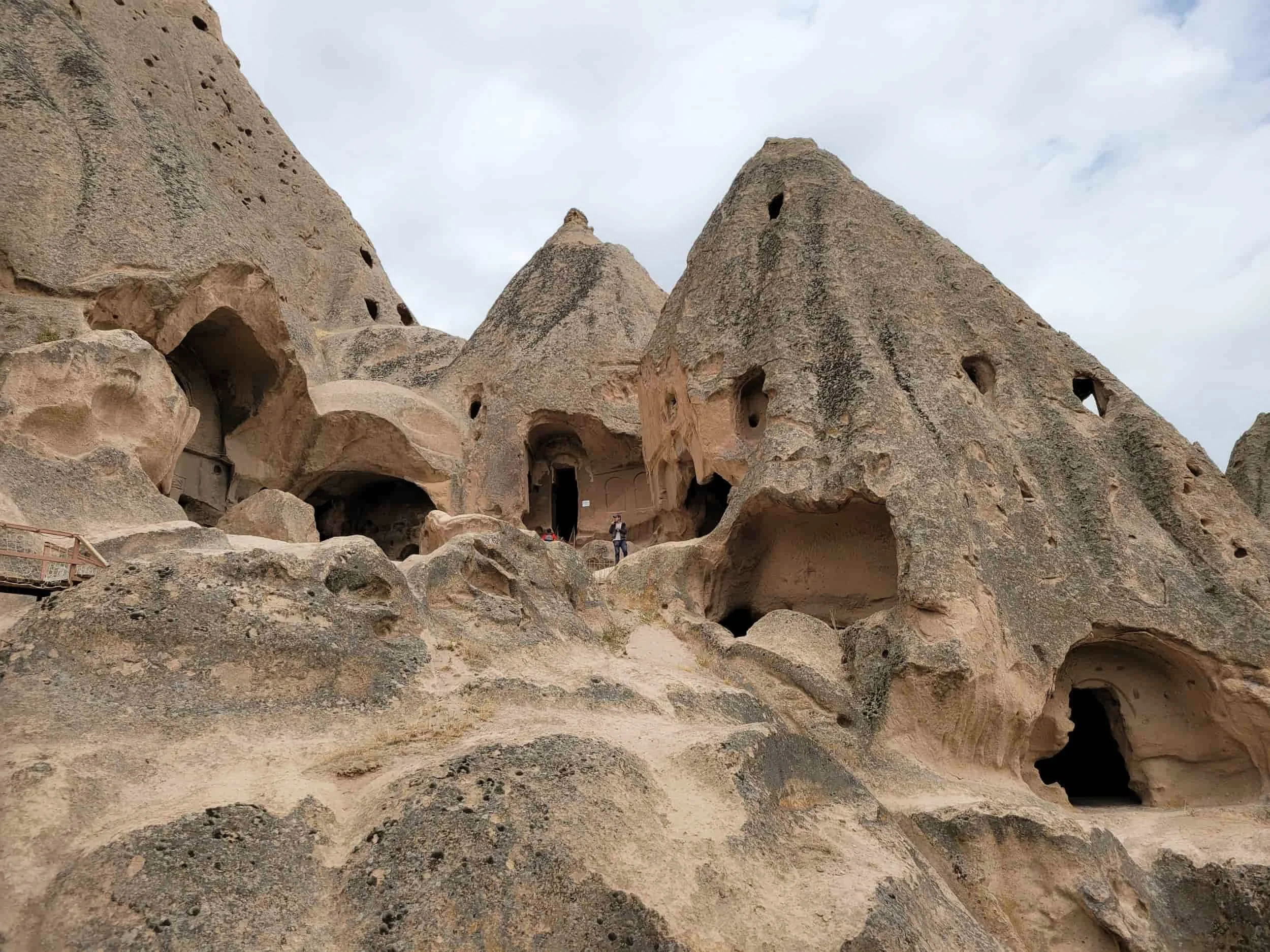 Rocky outcrop with carved caves at Selime Monastery in Cappadocia, Turkey