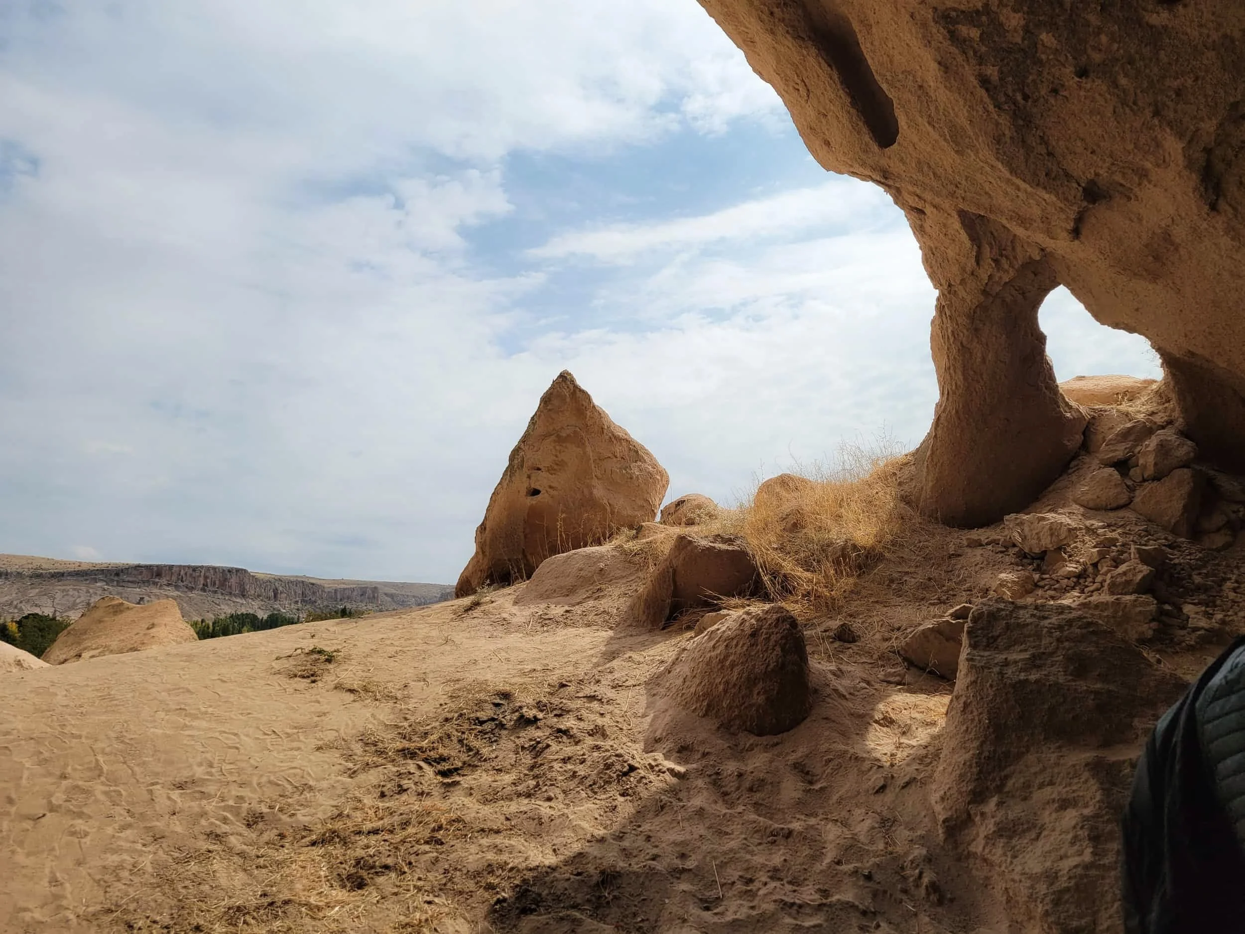 Rocky outcrop with carved caves at Selime Monastery in Cappadocia, Turkey