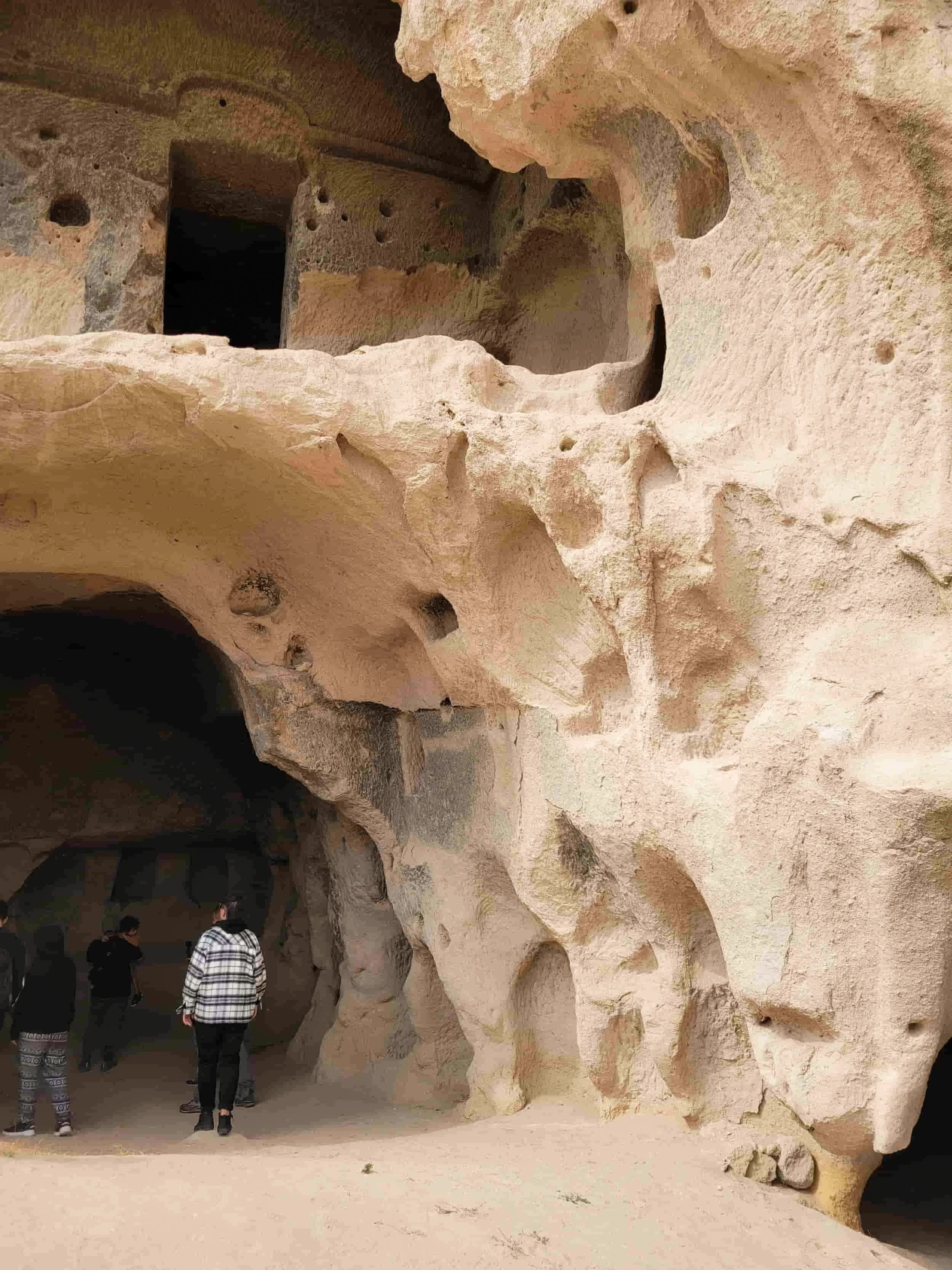 Rocky outcrop with carved caves at Selime Monastery in Cappadocia, Turkey
