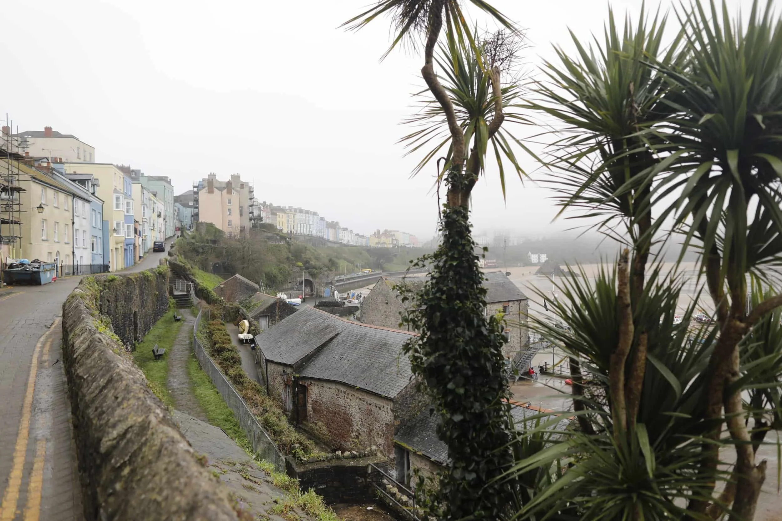 Views from above of the foggy beach and bay in Tenby Wales