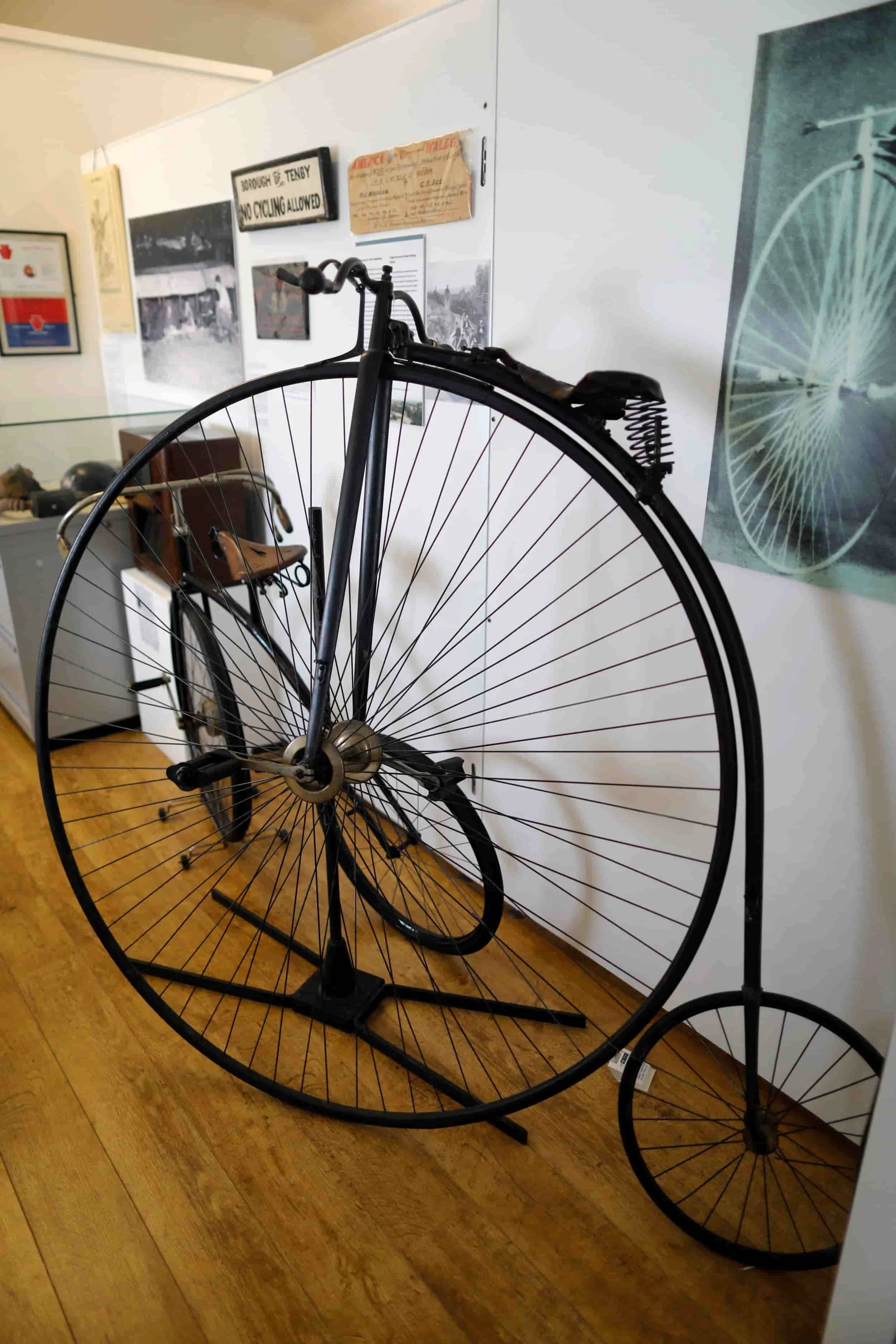 Black metal bicycle with one large wheel at Tenby Museum &amp; Art Gallery in Tenby Wales