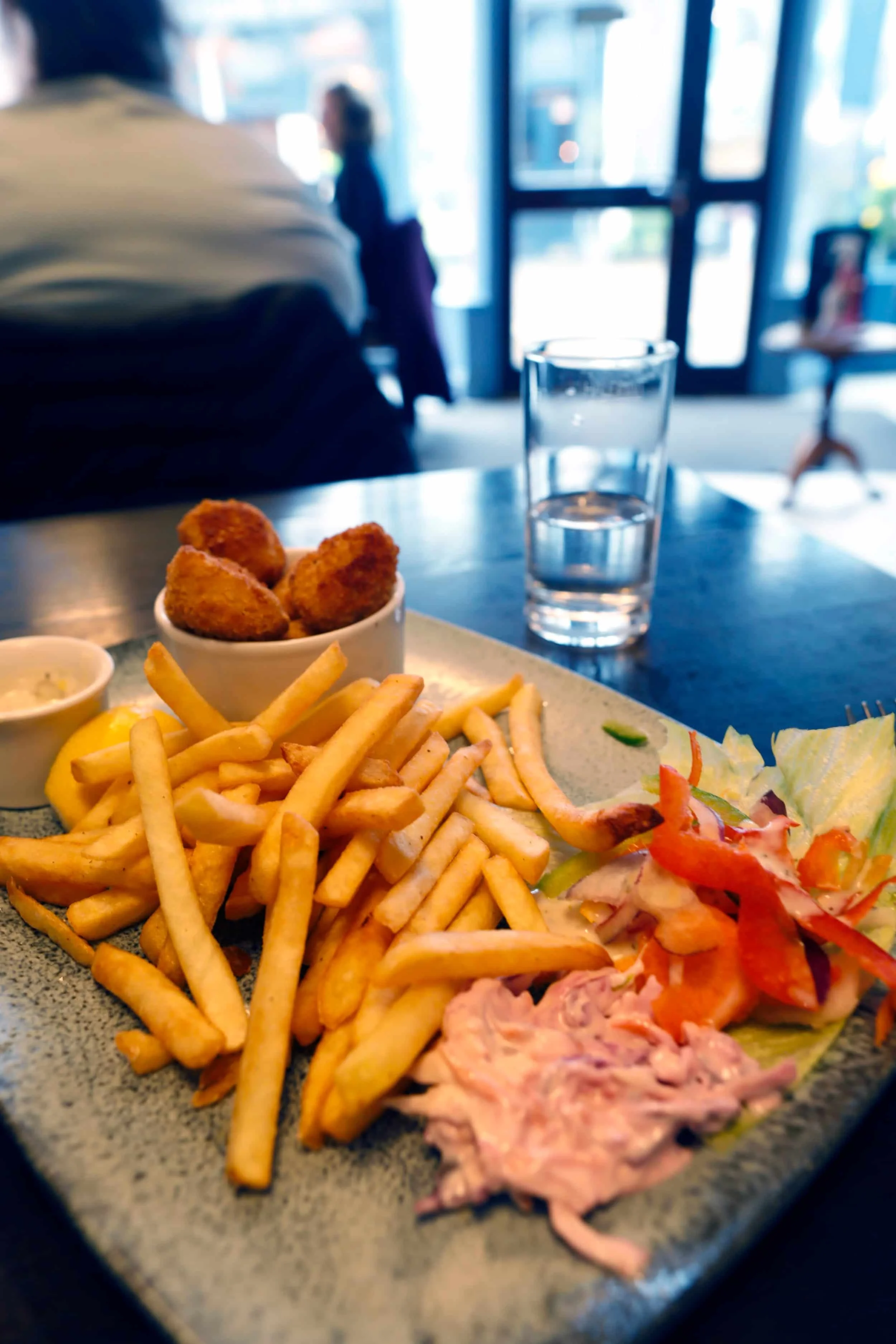 Plate of fish, french fries and slaw at No. 25 Café in Tenby Wales