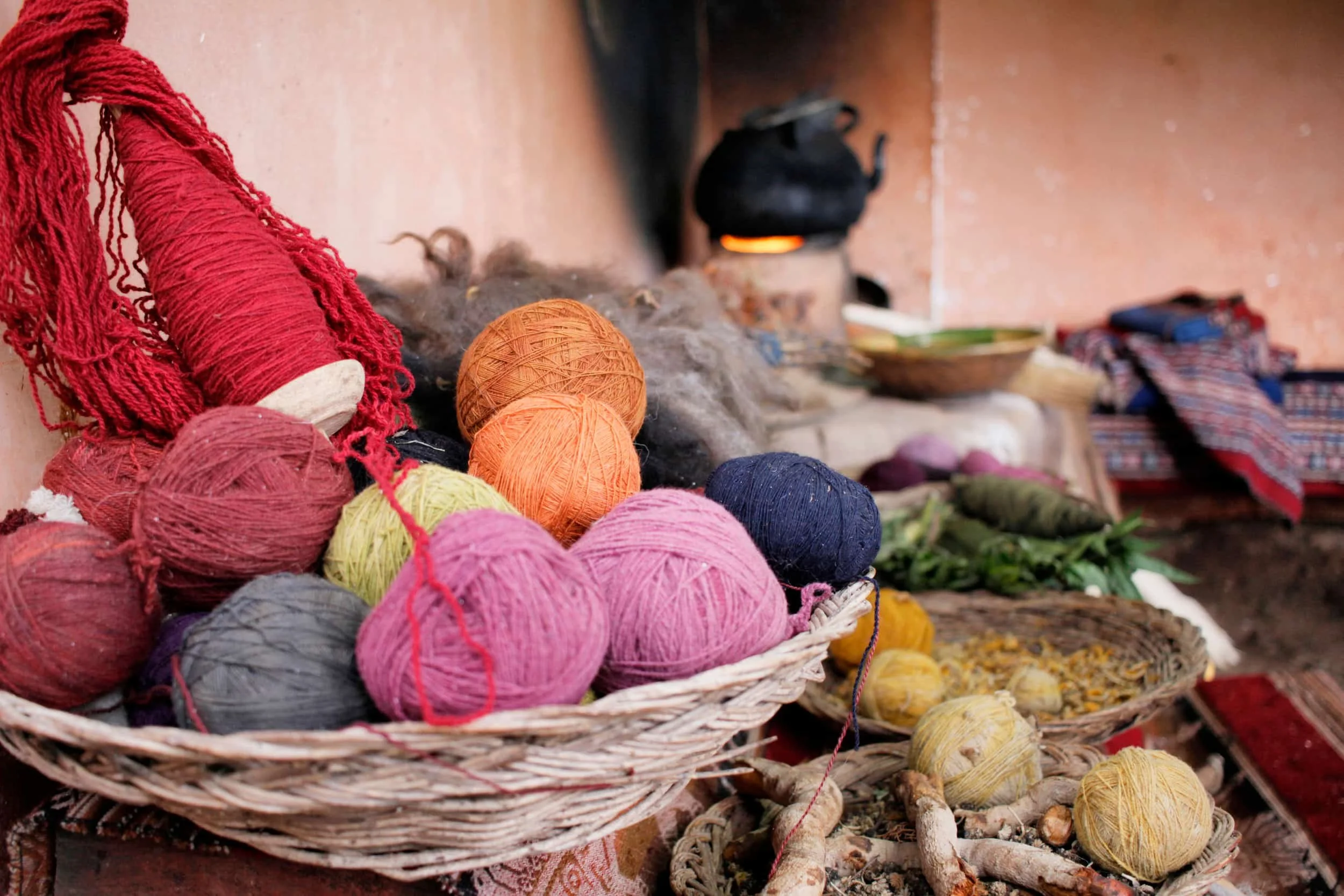 Basket with several colors of naturally dyed yarn in Peru, baskets and natural herbs beyond