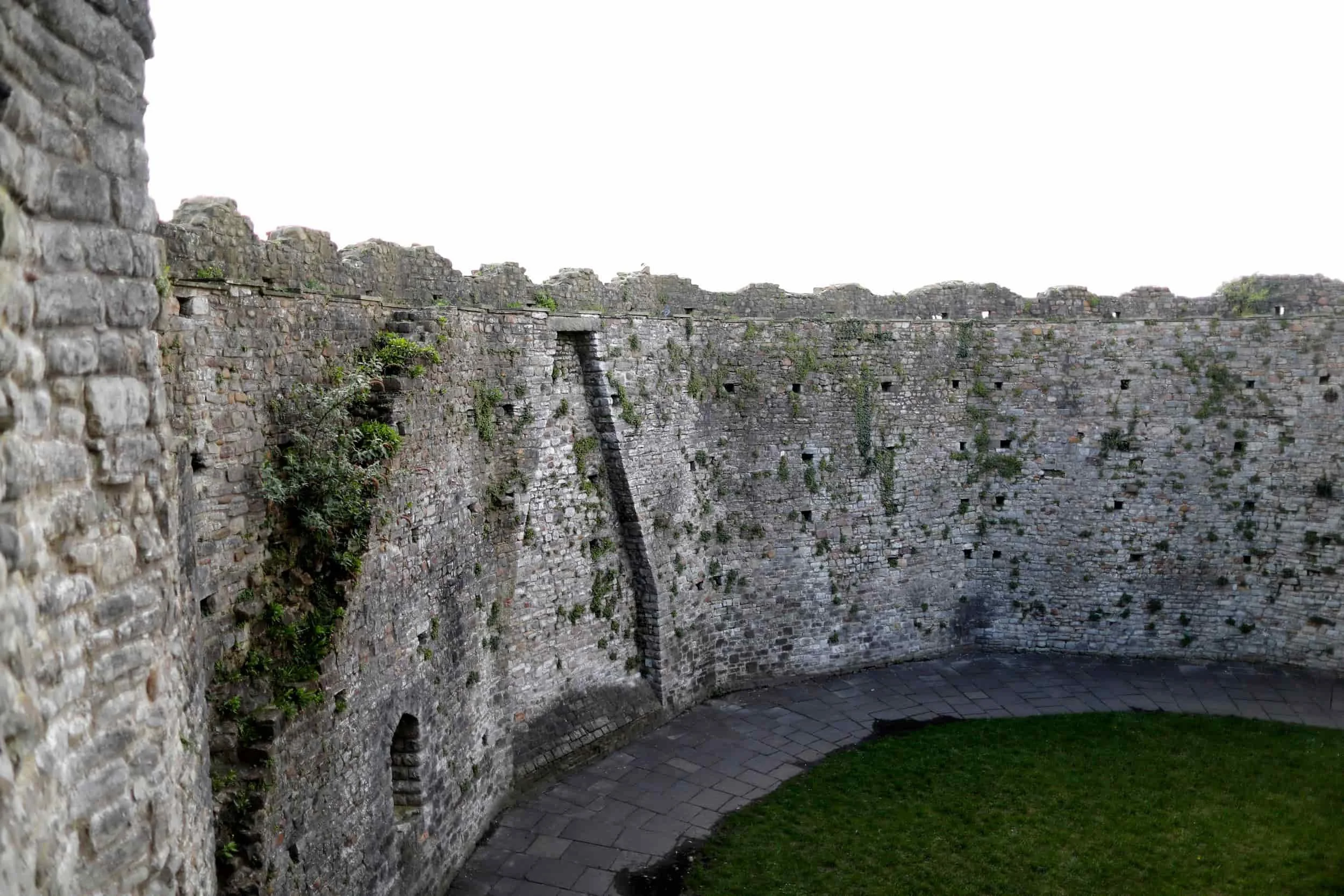 inside the Cardiff Castle Keep, stone walls and green grass