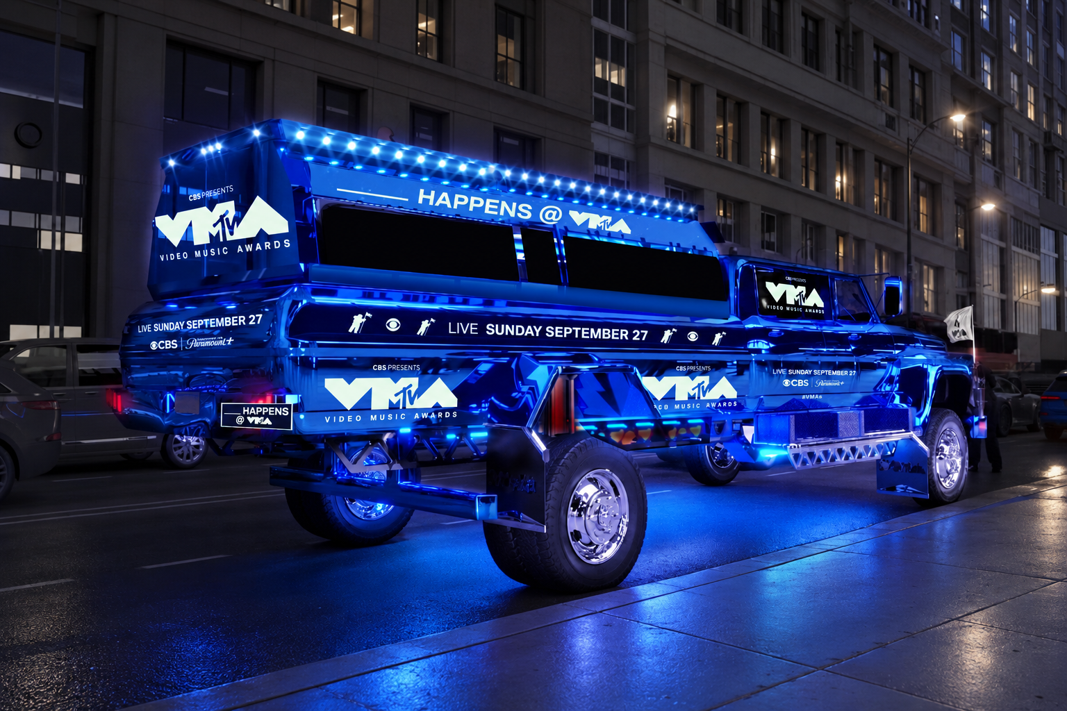 VMA bus beneath blue city lights.png