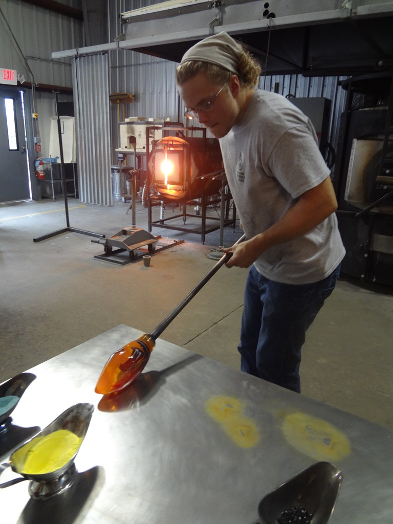 Cole Johnson blowing glass.