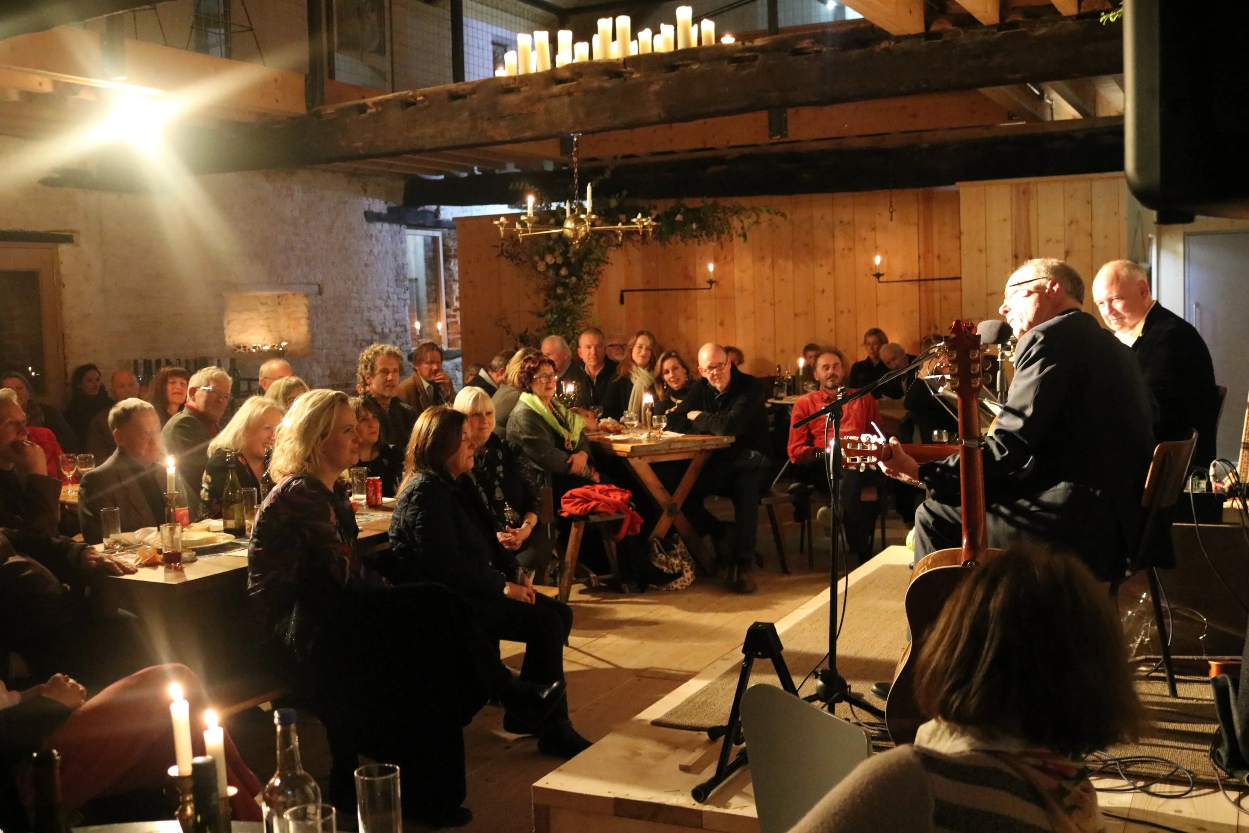 Terence Blacker and Louis de Bernieres performing their hilarious double act in a candlelit Abbey Hall