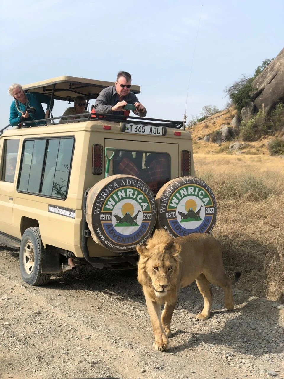 Guests on safari with Winrica Adventures in the Serengeti