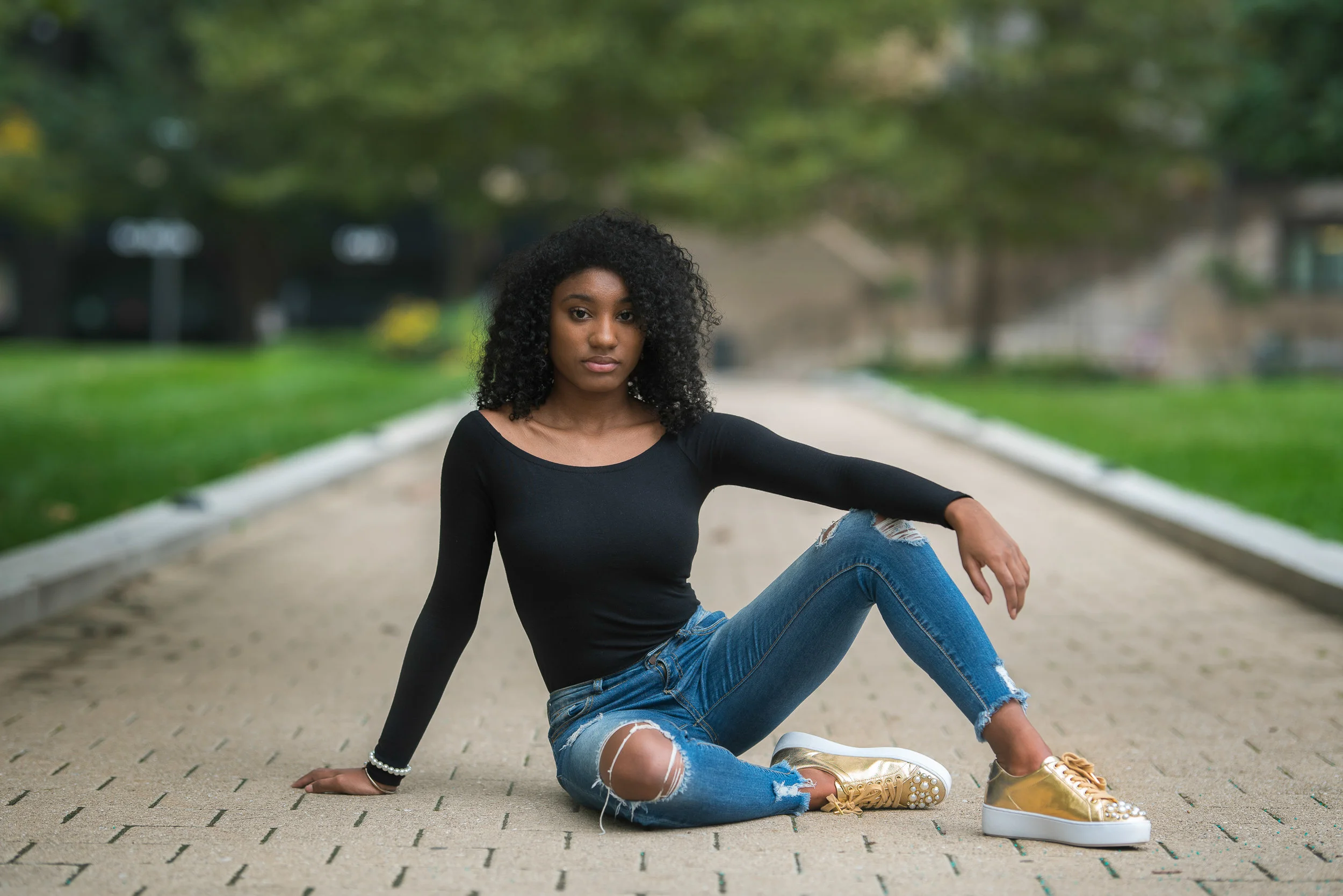 dancer-portrait-black-jeans-gold-sneakers-michael-kors.jpg