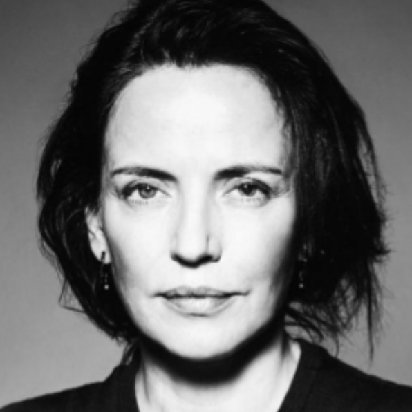 Black and white portrait of a woman with dark, shoulder-length hair, wearing a dark top.