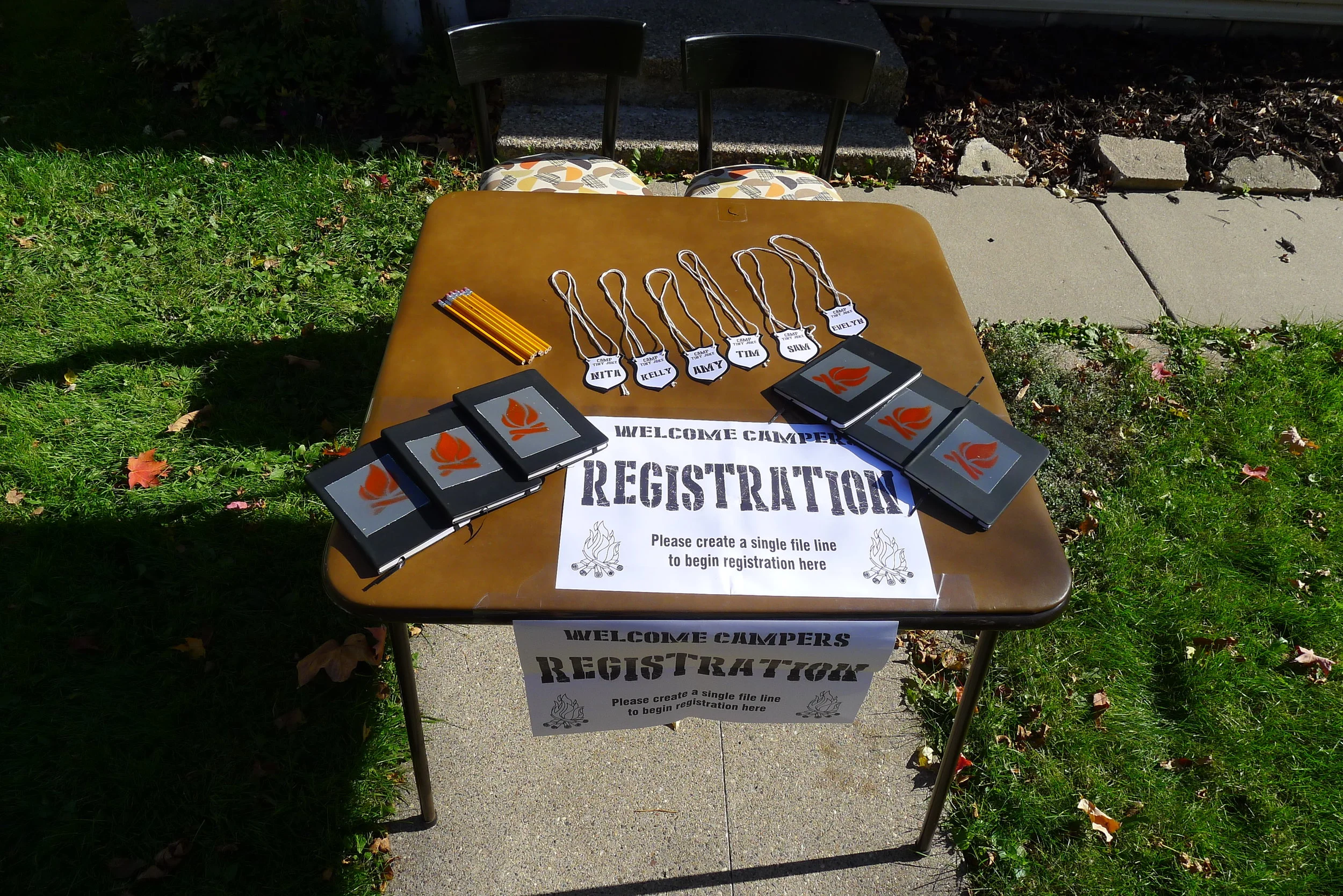  camp tiny joke registration offered campers their own name badge, notebook and an optional shot of camp courage 