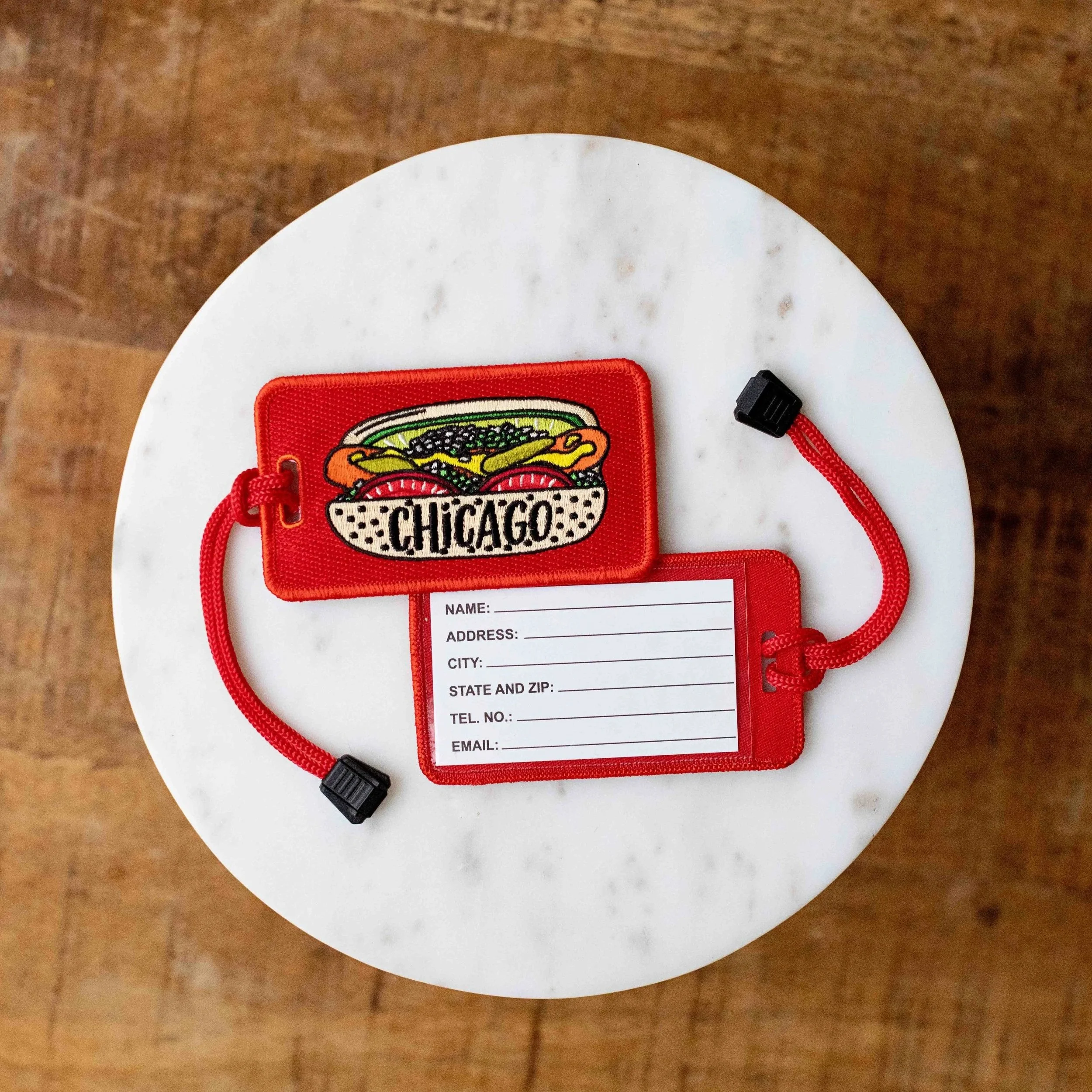 New Chicago Souvenir - Chicago Style Hot Dog Luggage Tag displayed on a marble table