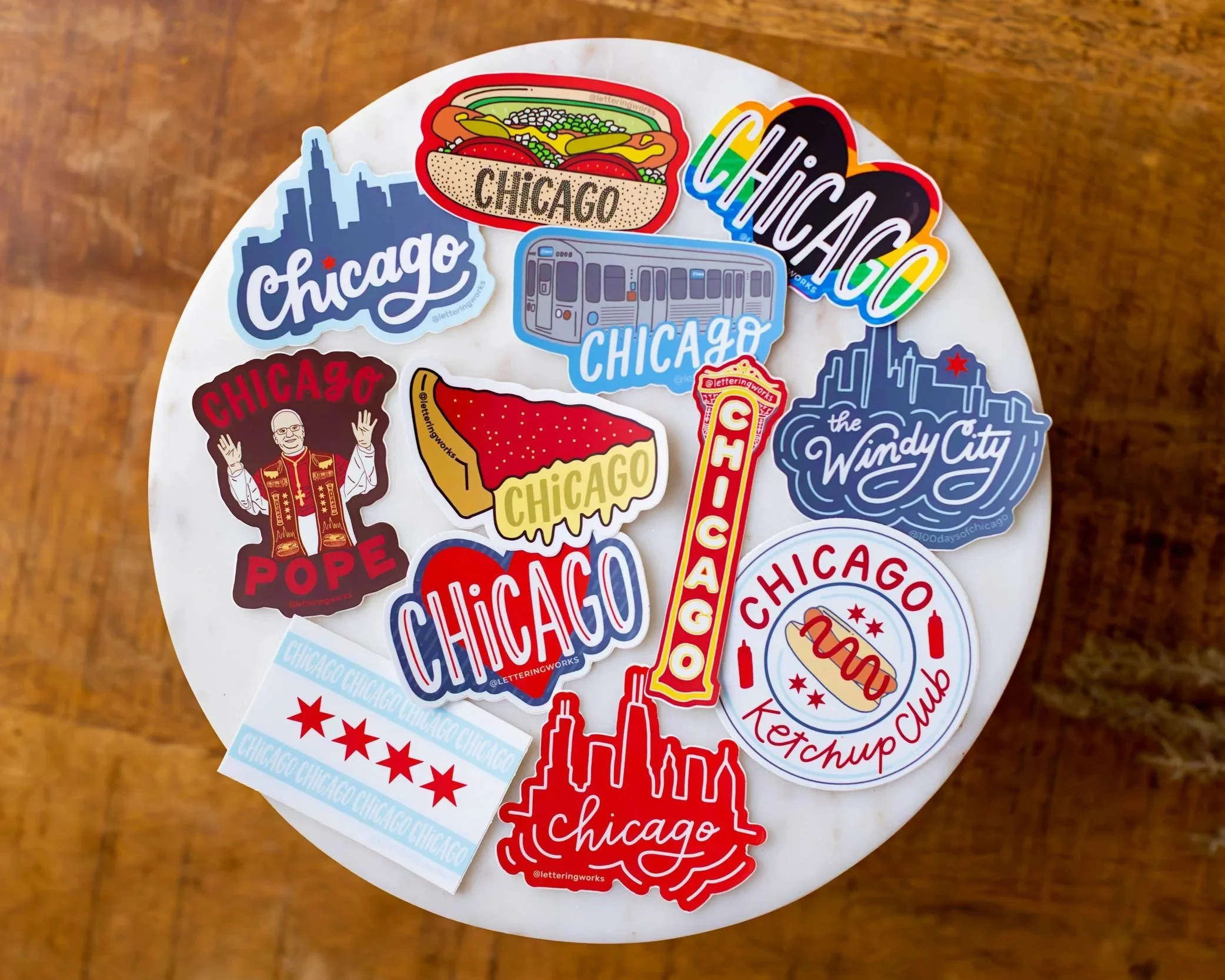 Chicago Souvenir Stickers: Chicago Style Hot Dog, Chicago Pride Heart, Windy City Skyline, Chicago Ketchup Club, Chicago Theatre Sign, Chicago Skyline, Chicago Heart, Chicago Flag, Chicago Pope, Chicago Deep Dish Pizza, and Chicago Blue Line L Train