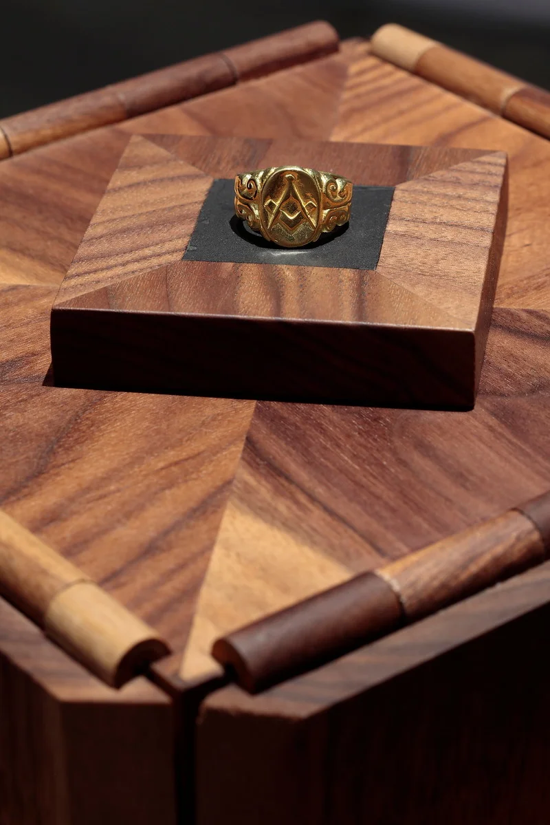Nate Young , Reliquary for an Imagined Family Heirloom (detail), 2017. 22k gold and walnut ring: 5/8 x 1 x 1 inches; Reliquary: 45 x 8.5 x 8.5 inches. Image courtesy of the artist and Monique Meloche Gallery, Chicago. Made in collaboration with Jay Sharpe.