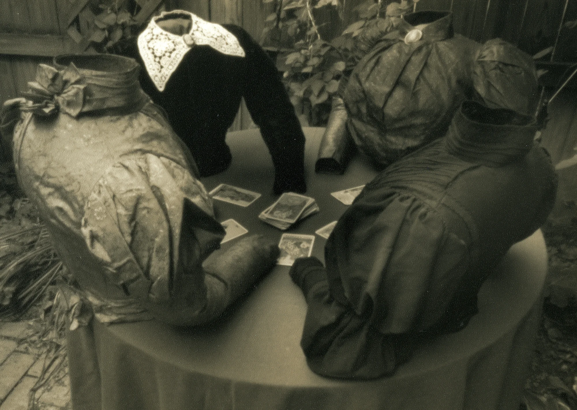Willie Anne Wright , "Caroline, Kate, and Friends Consult the Tarot,” from Tableaux , 2001. Sepia toned silver print from a pinhole negative. Image courtesy of the artist and Candela Gallery , Richmond.