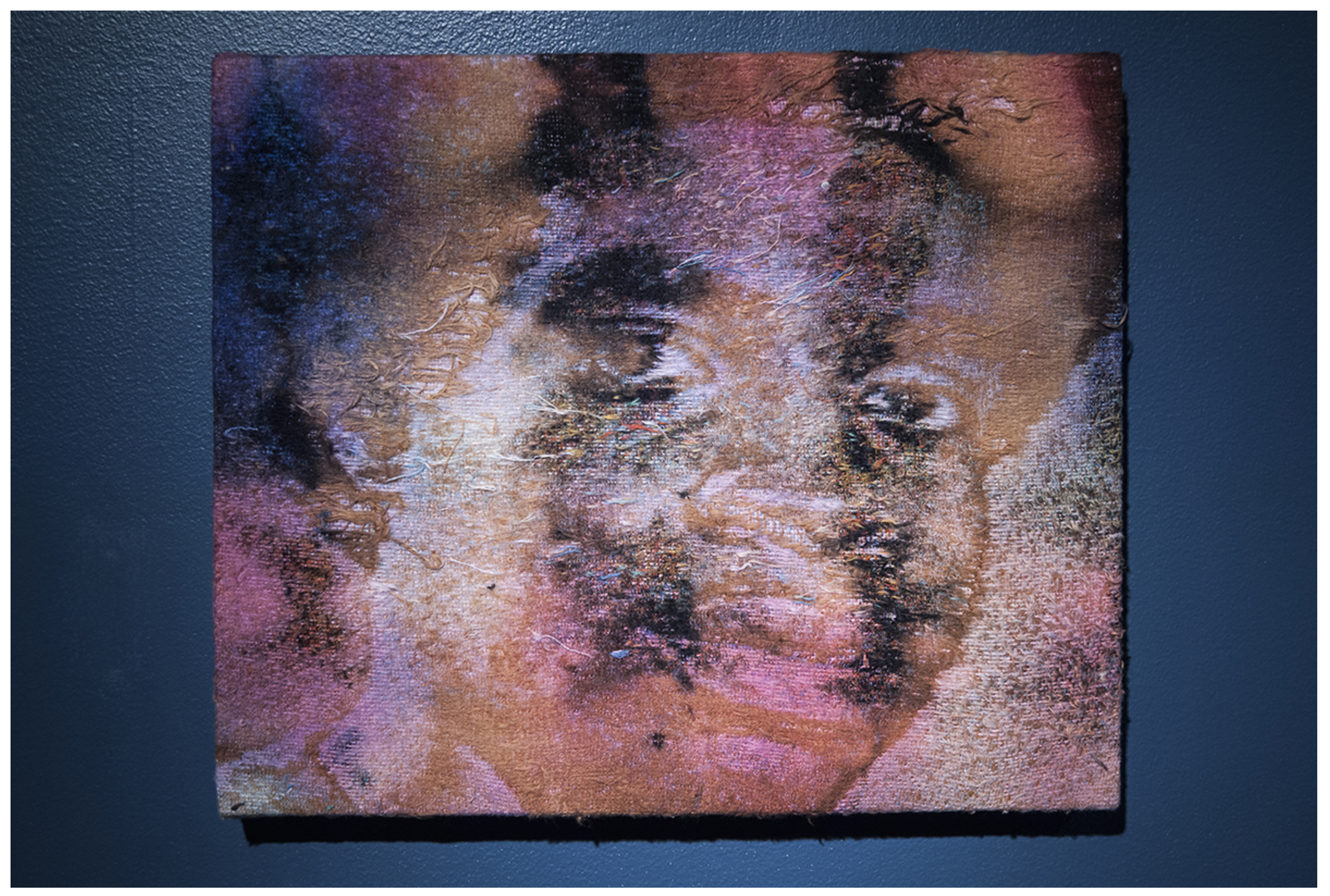Sportsman , 2016, Bleach and dye on distressed, stretched Jacquard tapestry (barbershop portrait), 15” x 18”
