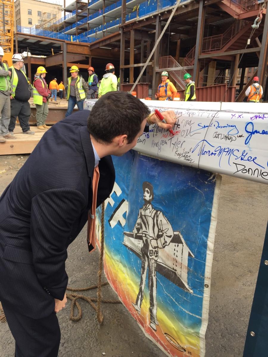 Mike signing the final beam to the MGM hotel.