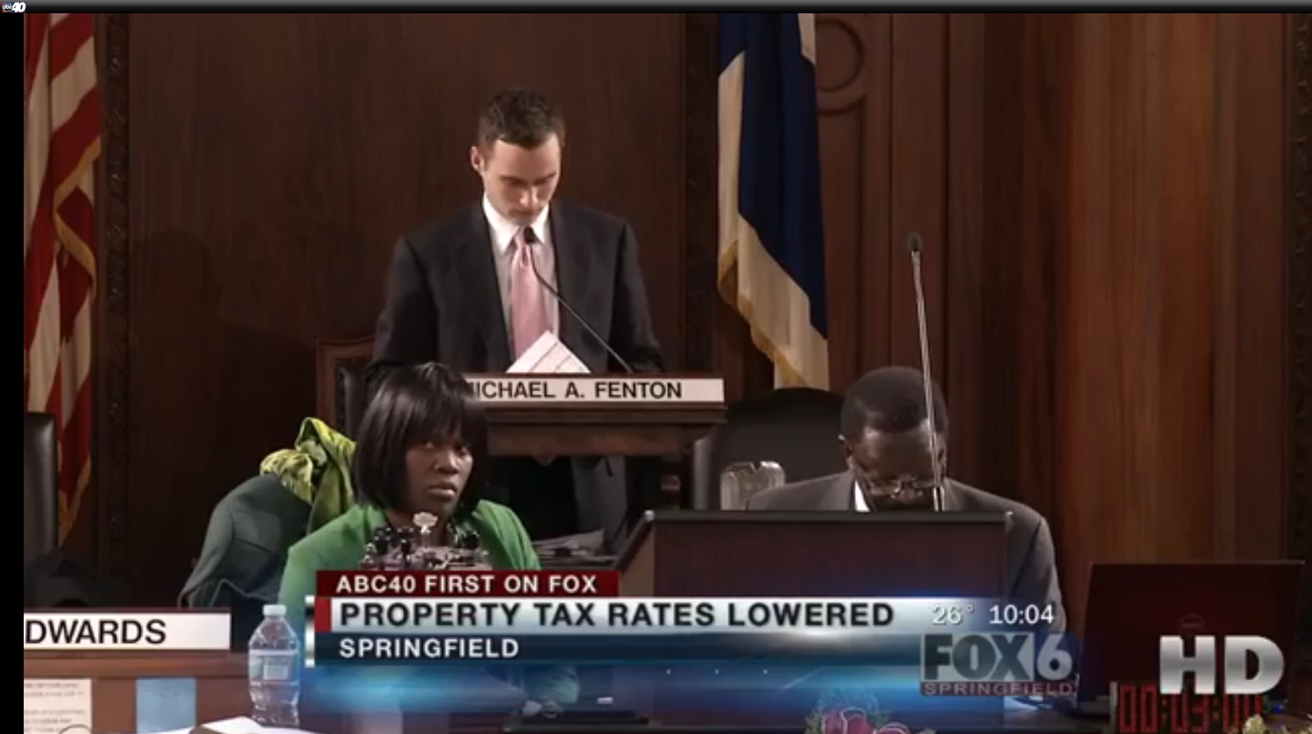 Mike presiding over meeting to reduce property taxes.