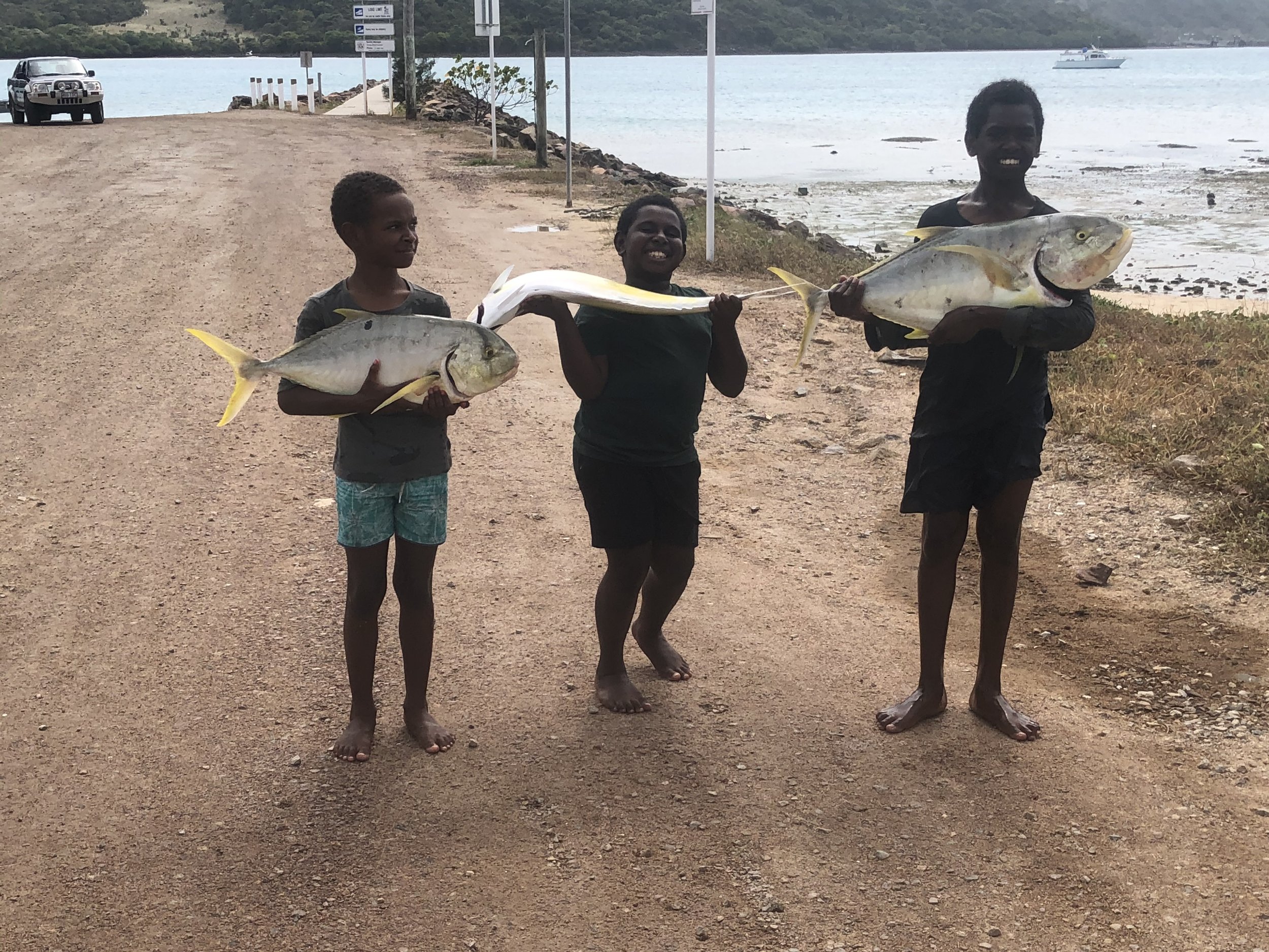 Proud local kids with their catch