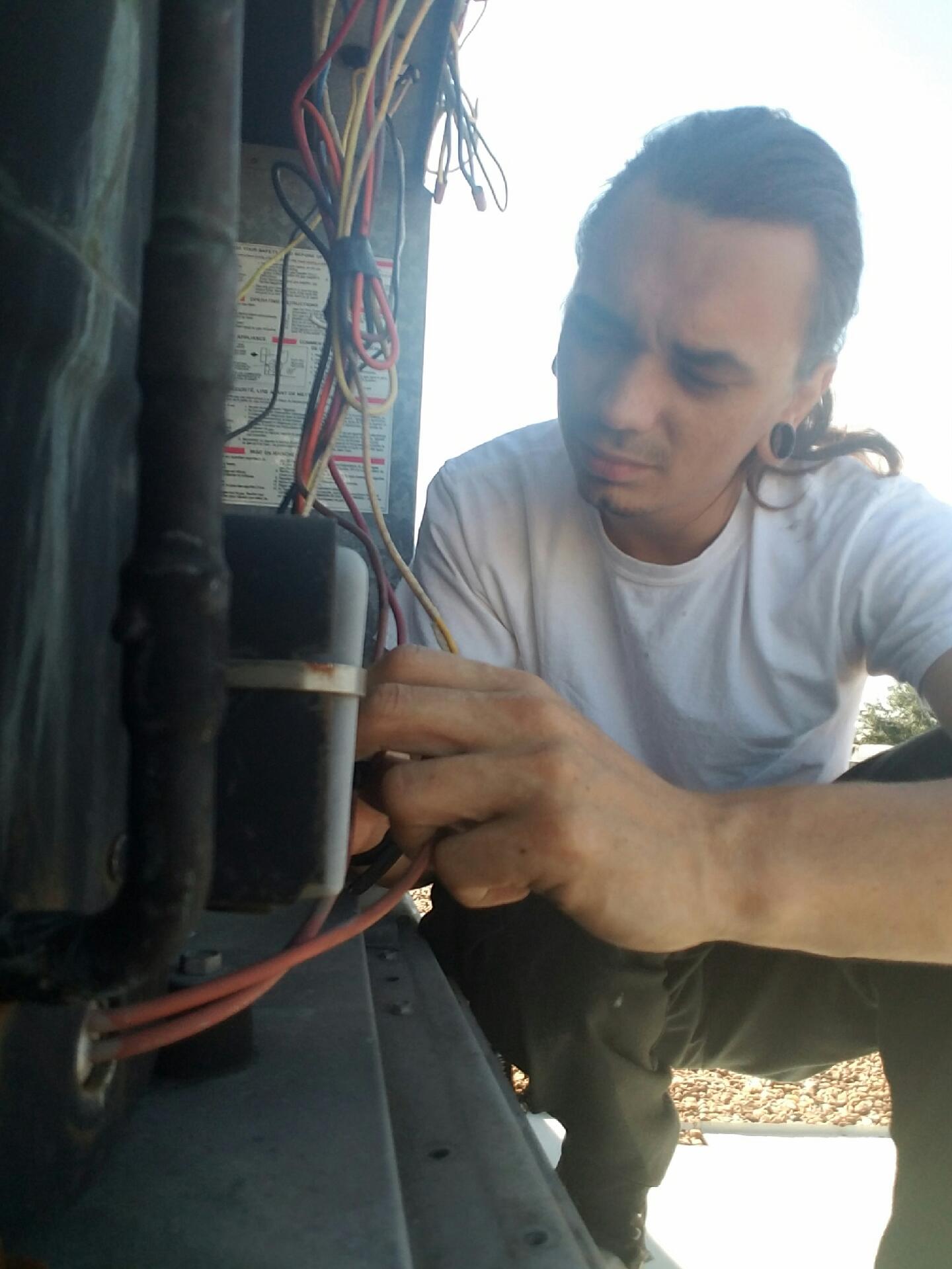 Jonathan repairing a commercial package unit