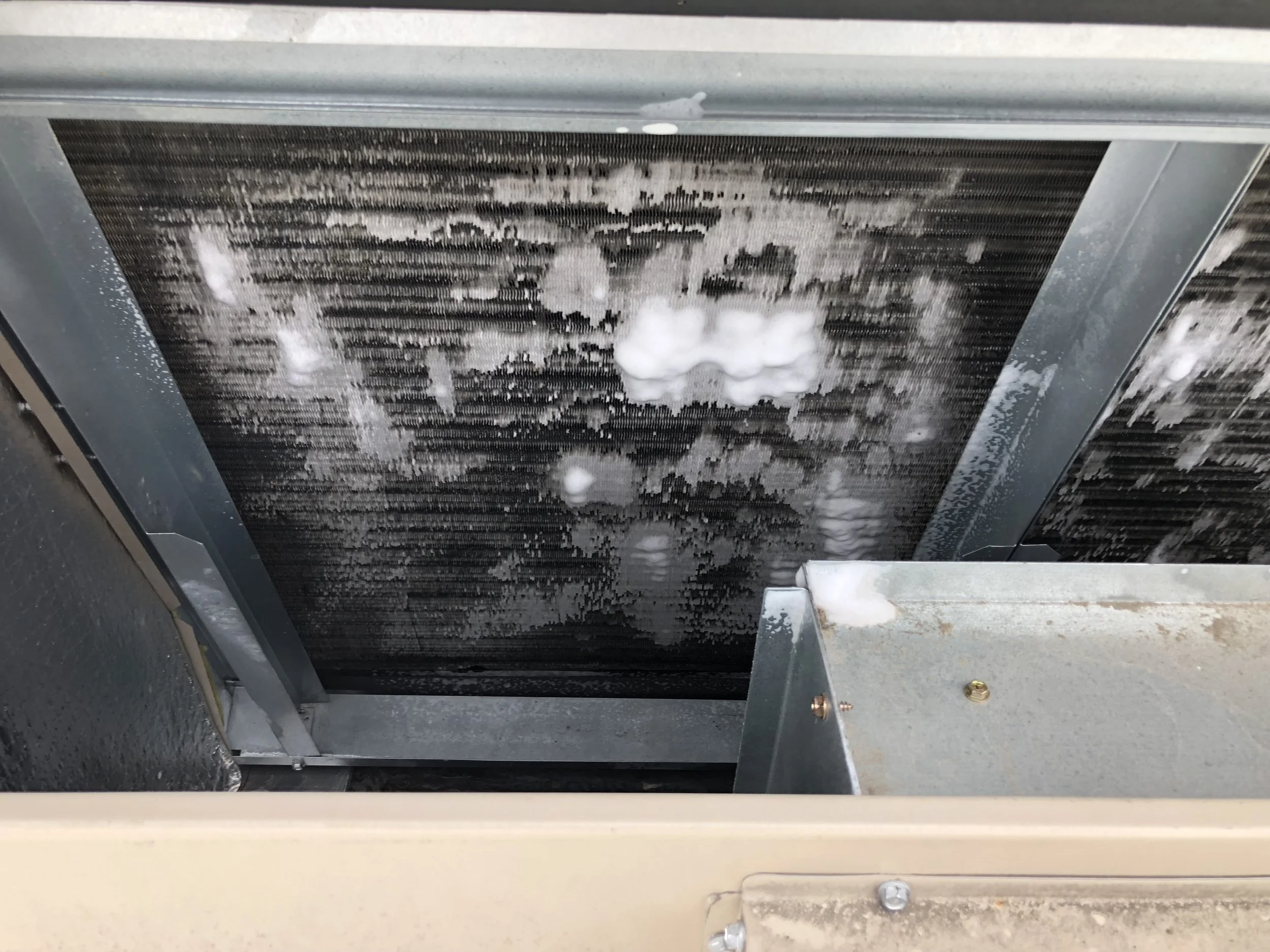 Jonathan doing routine maintenance on a rooftop #revairtx #revolutionair #houstonhvacrepair #preventivemaintenance #coilcleaning