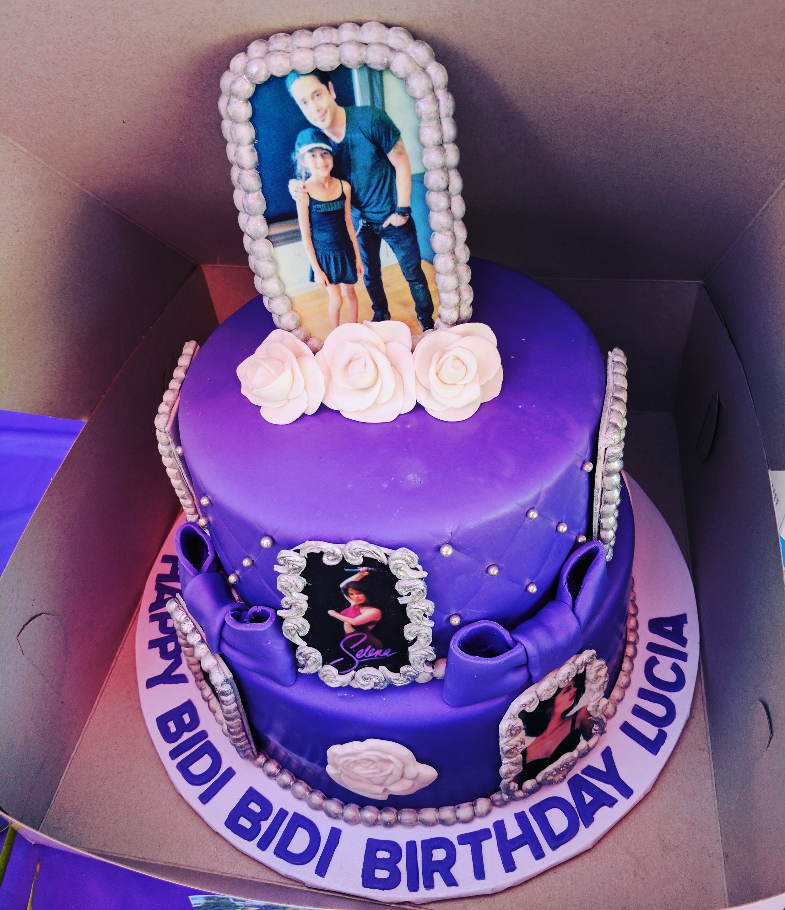 Lucia pictured with the late singer's husband Chris Perez on the "Bidi Bidi Cake" topper. (Selena's famous song "Bidi Bidi Bom Bom" has become an anthem of sorts during Latino parties).