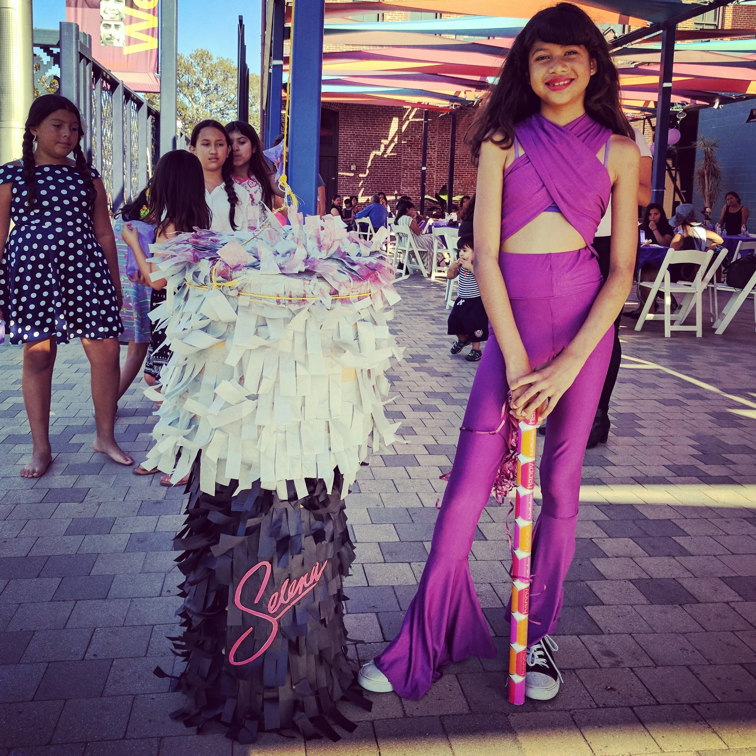 The birthday girl's mom made the Selena microphone piñata and has since decided to launch her own piñata business, Party Girl Piñatas.