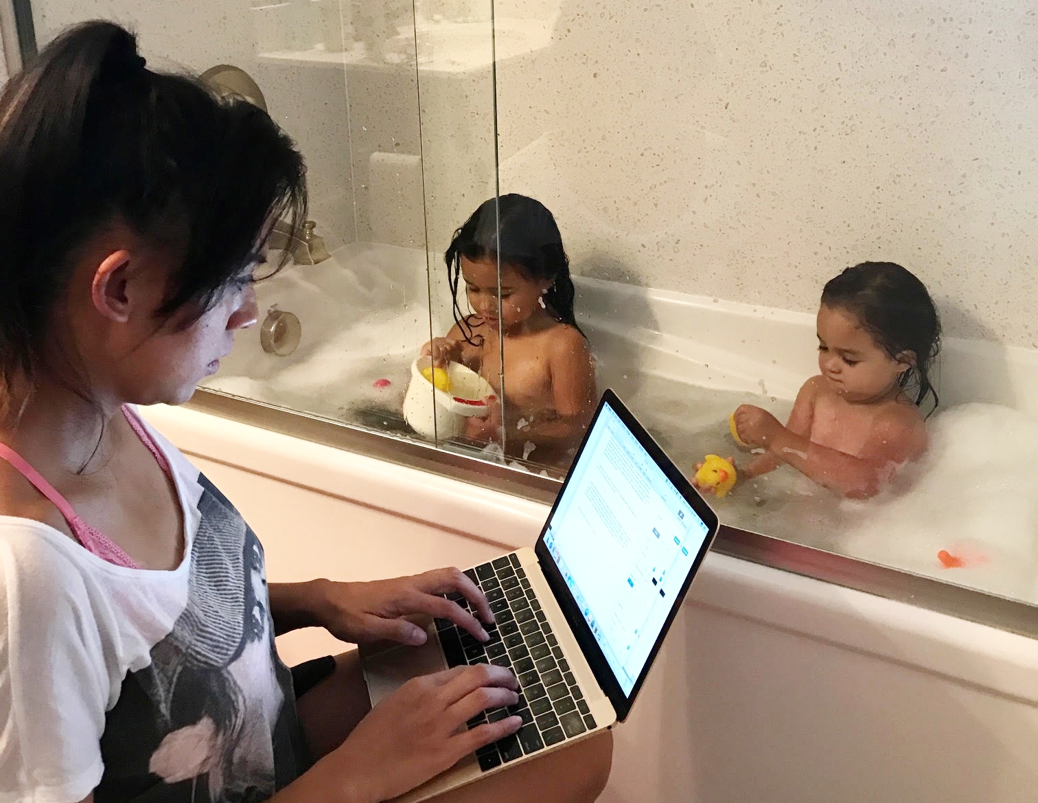 Salva with two of her daughters, on a typical night of multi-tasking.