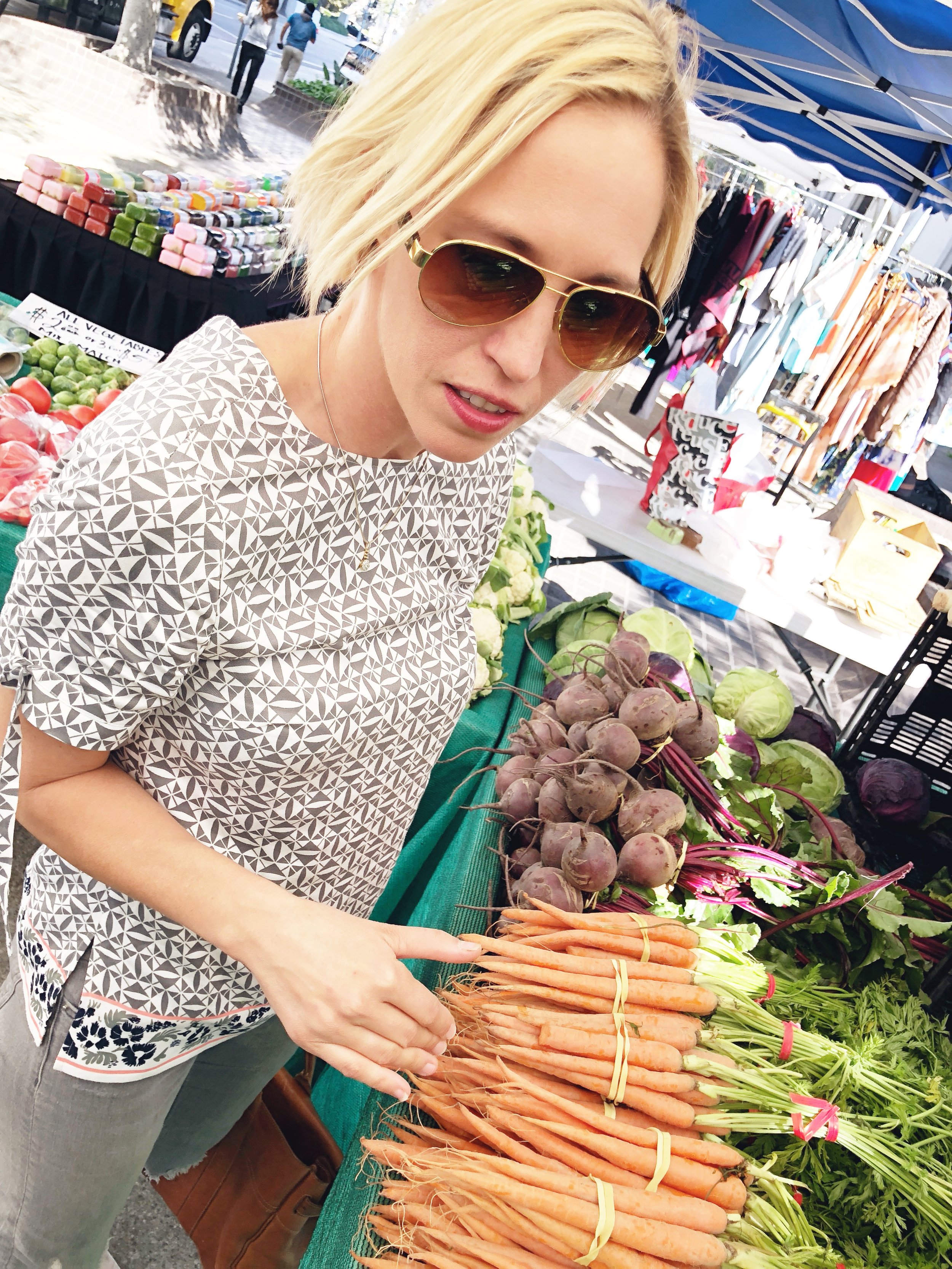 Kerstin explains what she looks for in shopping for fruits and vegetables during a trip to a Farmer's Market in Downtown Los Angeles.