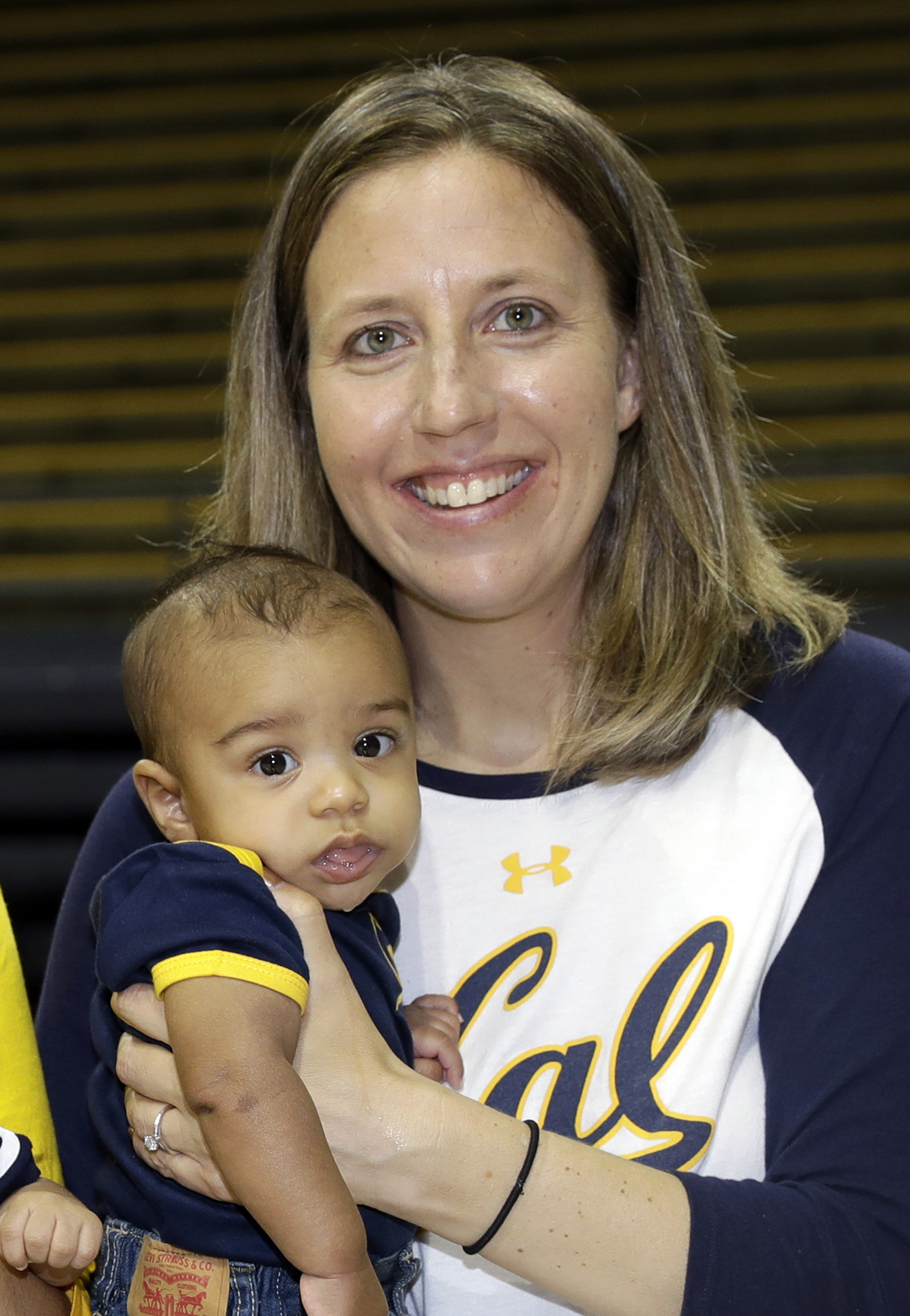 In an Aug. 30, 2017, photo, California women's basketball coach Lindsay Gottlieb holds her then-6-month-old son, Jordan, during NCAA college basketball practice on the campus.