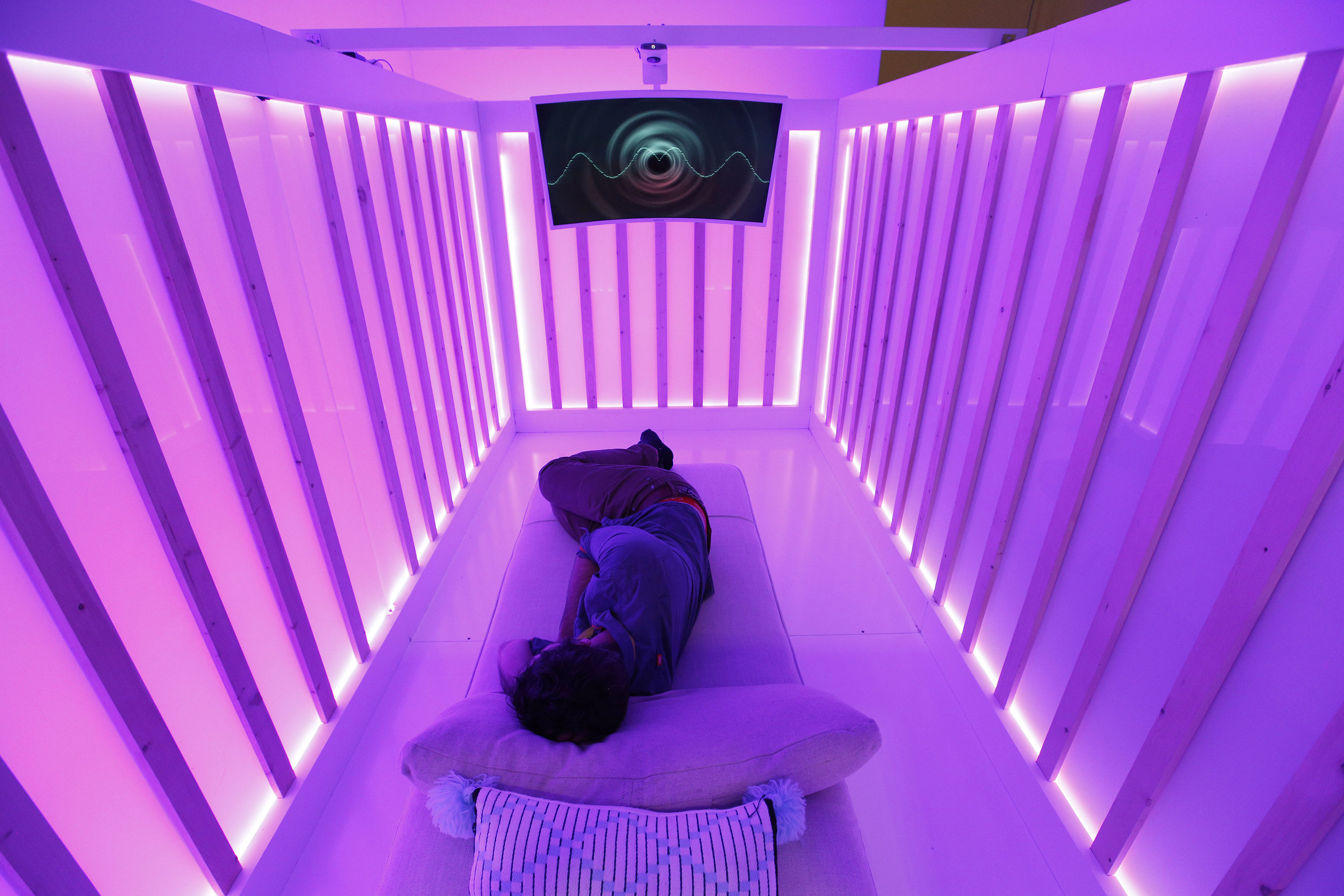An attendee tests the Miku baby sleep and breathing monitor at the Miku  booth at CES International, Wednesday, Jan. 9, 2019, in Las Vegas. (AP  Photo/John Locher)