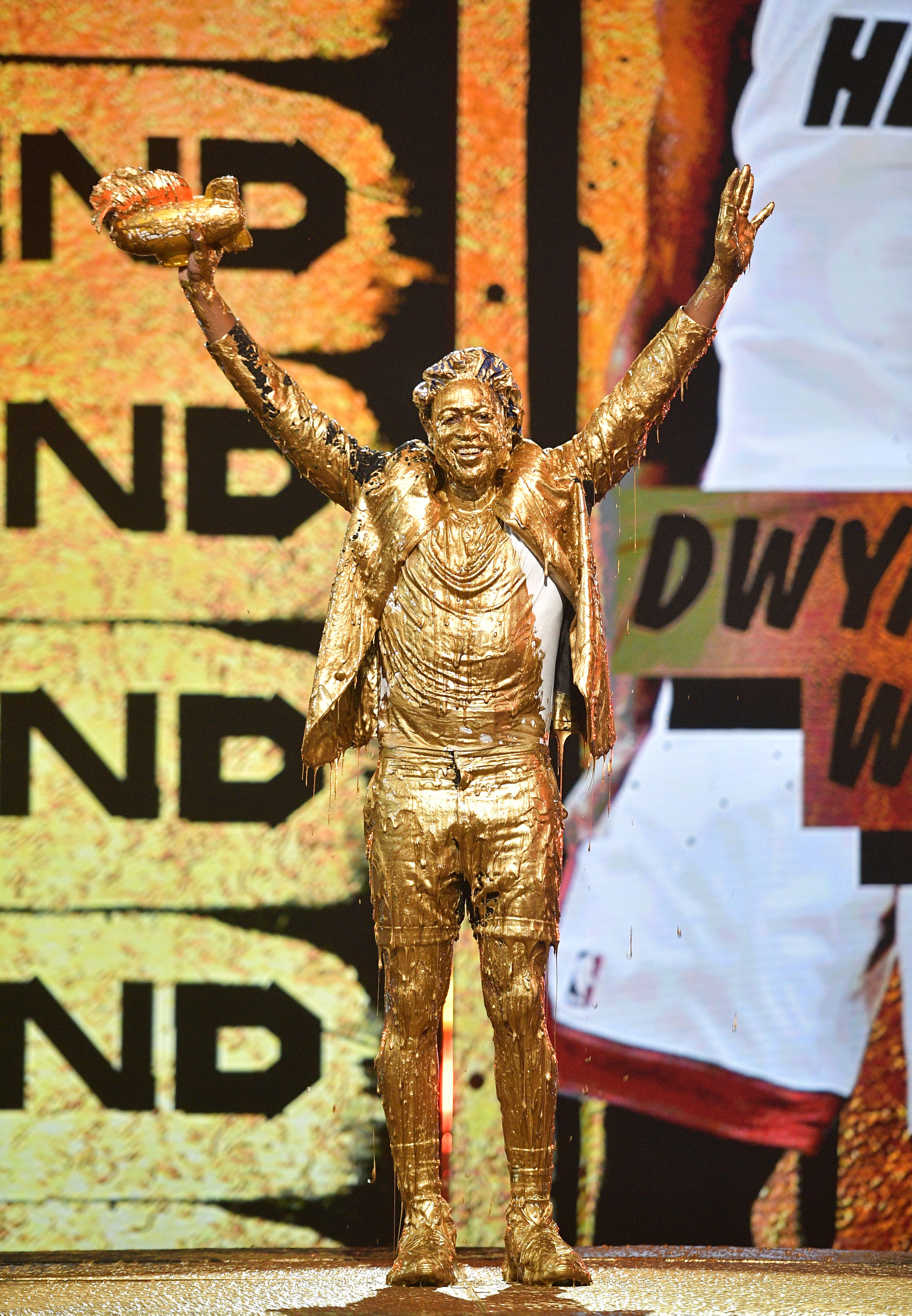 Dwyane Wade gets slimed while accepting the Legend Award onstage during Nickelodeon Kids' Choice Sports 2019 at Barker Hangar on July 11, 2019 in Santa Monica, California. (Photo by Matt Winkelmeyer/KCASports2019/Getty Images for Nickelodeon)