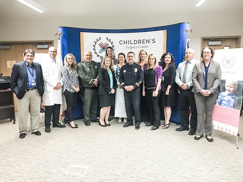 Our founding board & multi-disciplinary team in April 2016 at our first press conference. (From left to right: Dean Germano - CEO of Shasta Community Health Center (SCHC), Dr. Sean Dugan - Child Abuse Pediatrician w/ SCHC, Erin Resner - Redding City Council member & Board Treasurer, Sheriff Tom Bosenko - Shasta County Sheriffs Office, Senior Deputy District Attorney Sarah Murphy, CEO Kimberly Johnson, Child Welfare Branch Director Dianna Wagner, former Redding Police Chief Robert Paoletti (Redding Police Chief Roger Moore is our current board member, District Attorney Stephanie Bridgett - Board Secretary, Senior Victims Advocate at the Districty Attorney’s Office Deborah Heide, Child Welfare Supervisor Cindy Lane, Detective Chris Edwards - Shasta County Sheriff’s Office, Corporal Liz Harris - Redding Police Department)