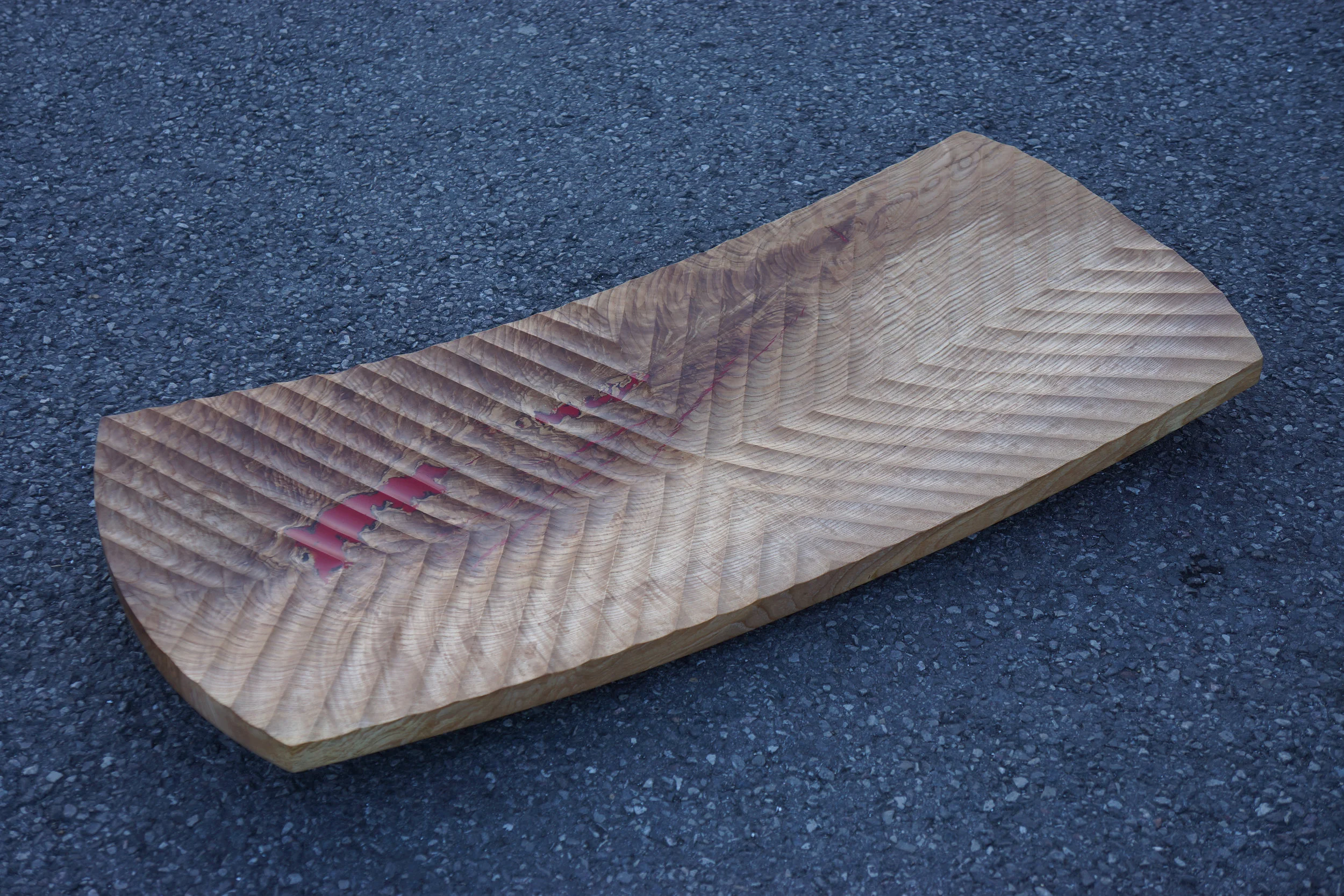  A large turned platter carved in a Chevron fluted pattern and red epoxy in the holes. 